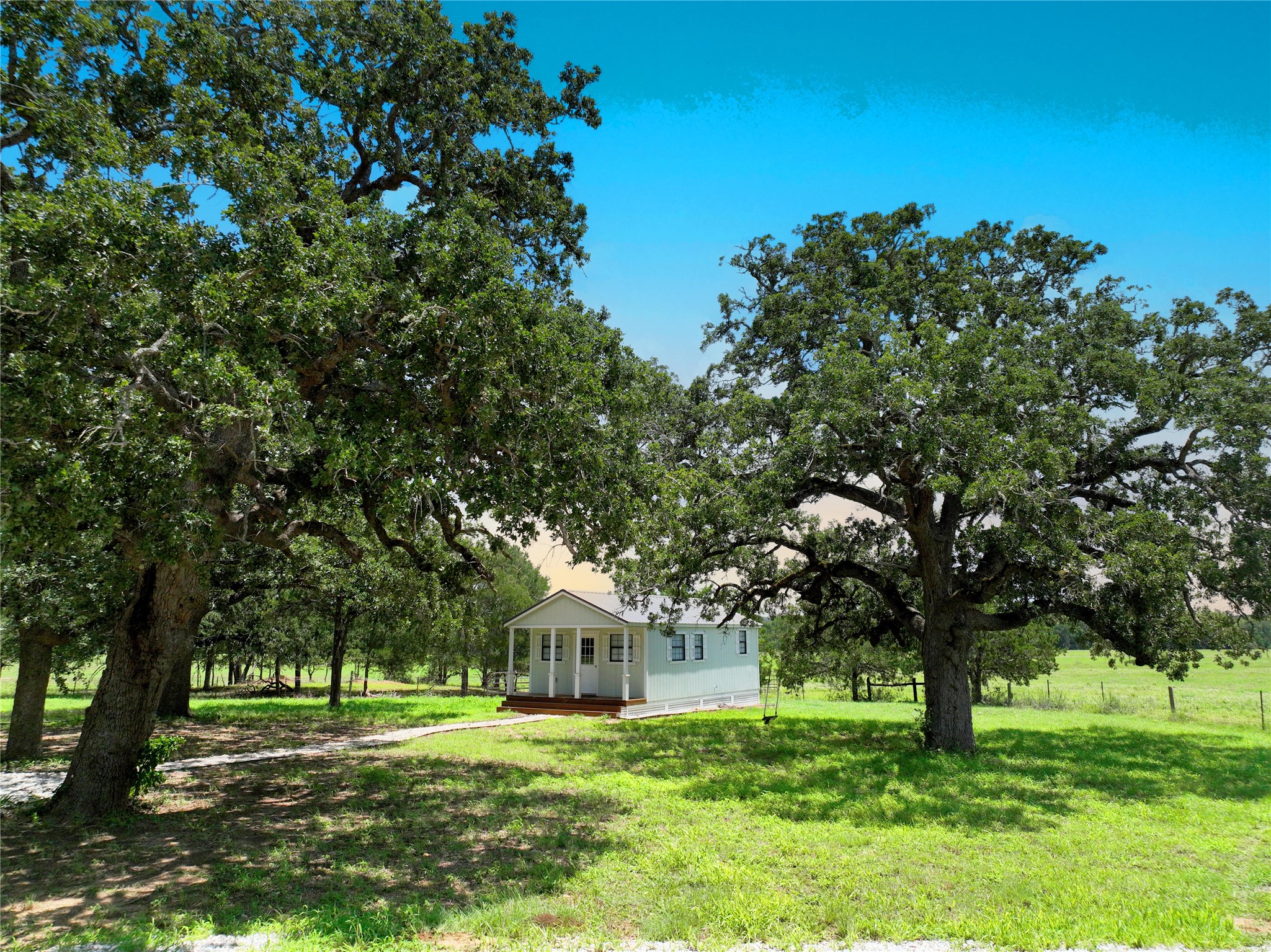 141 Grassyville Road Paige, TX 78659 - Photo 19 of 34 a front view of a house with a yard