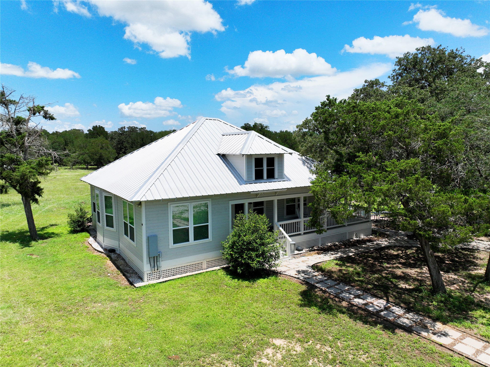 141 Grassyville Road Paige, TX 78659 - Photo 2 of 34 a view of a house with a yard