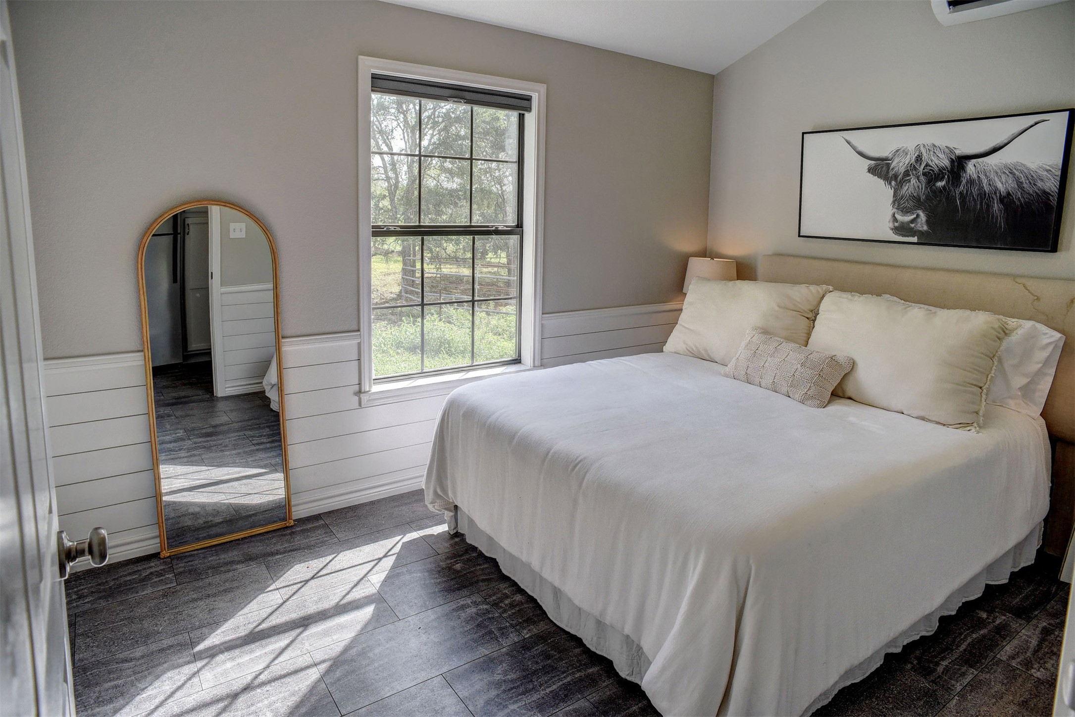 141 Grassyville Road Paige, TX 78659 - Photo 22 of 34 a bedroom with a bed and a large window