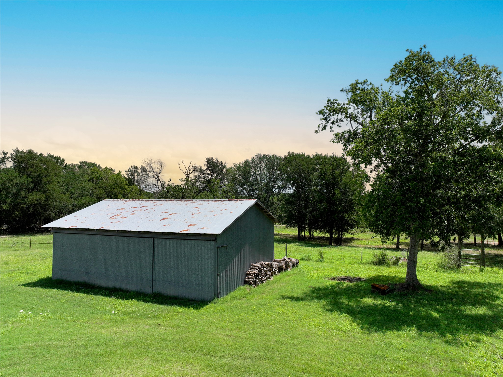 141 Grassyville Road Paige, TX 78659 - Photo 25 of 34 a view of a park with a house in the background