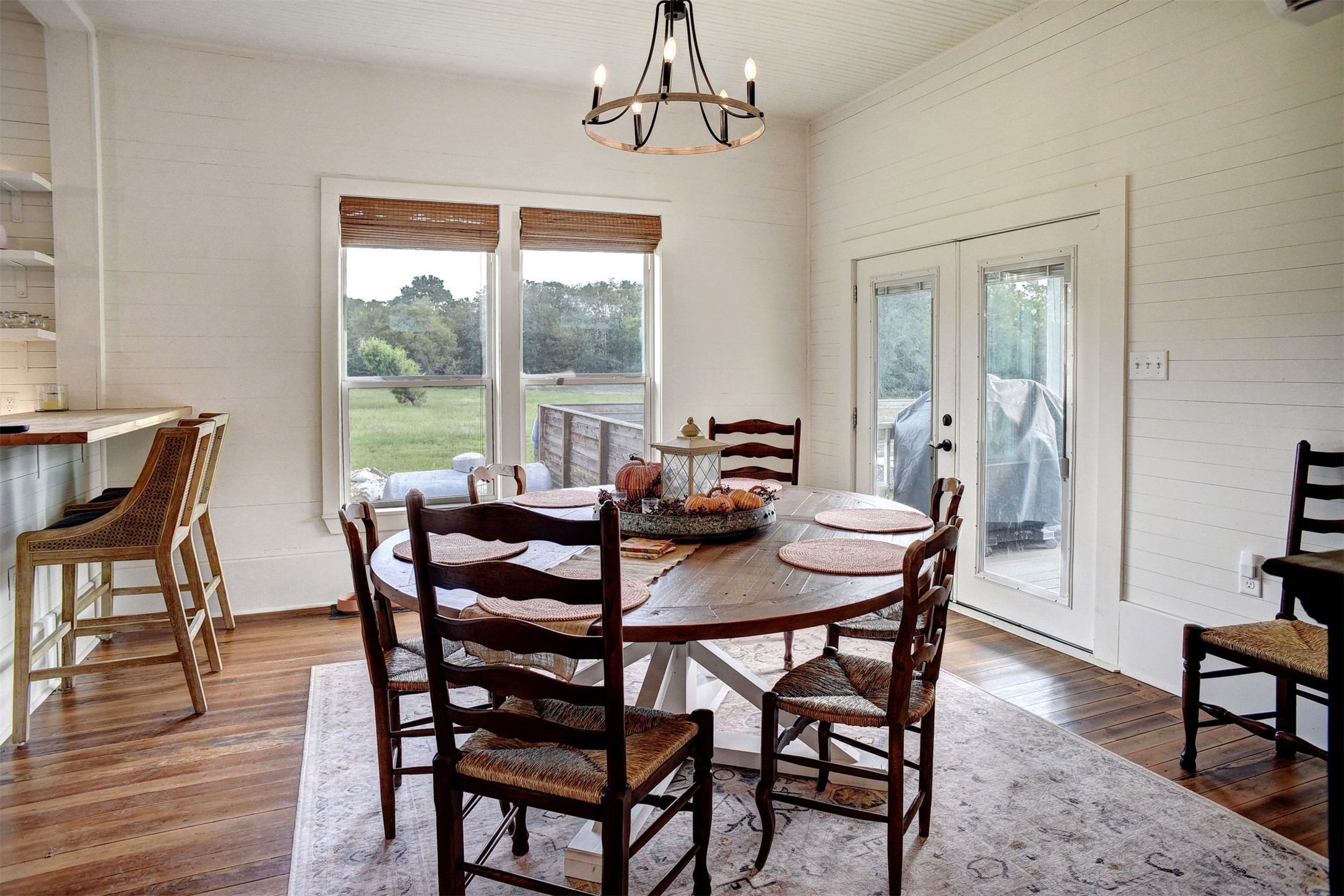 141 Grassyville Road Paige, TX 78659 - Photo 8 of 34 a view of a dining room with furniture window and wooden floor