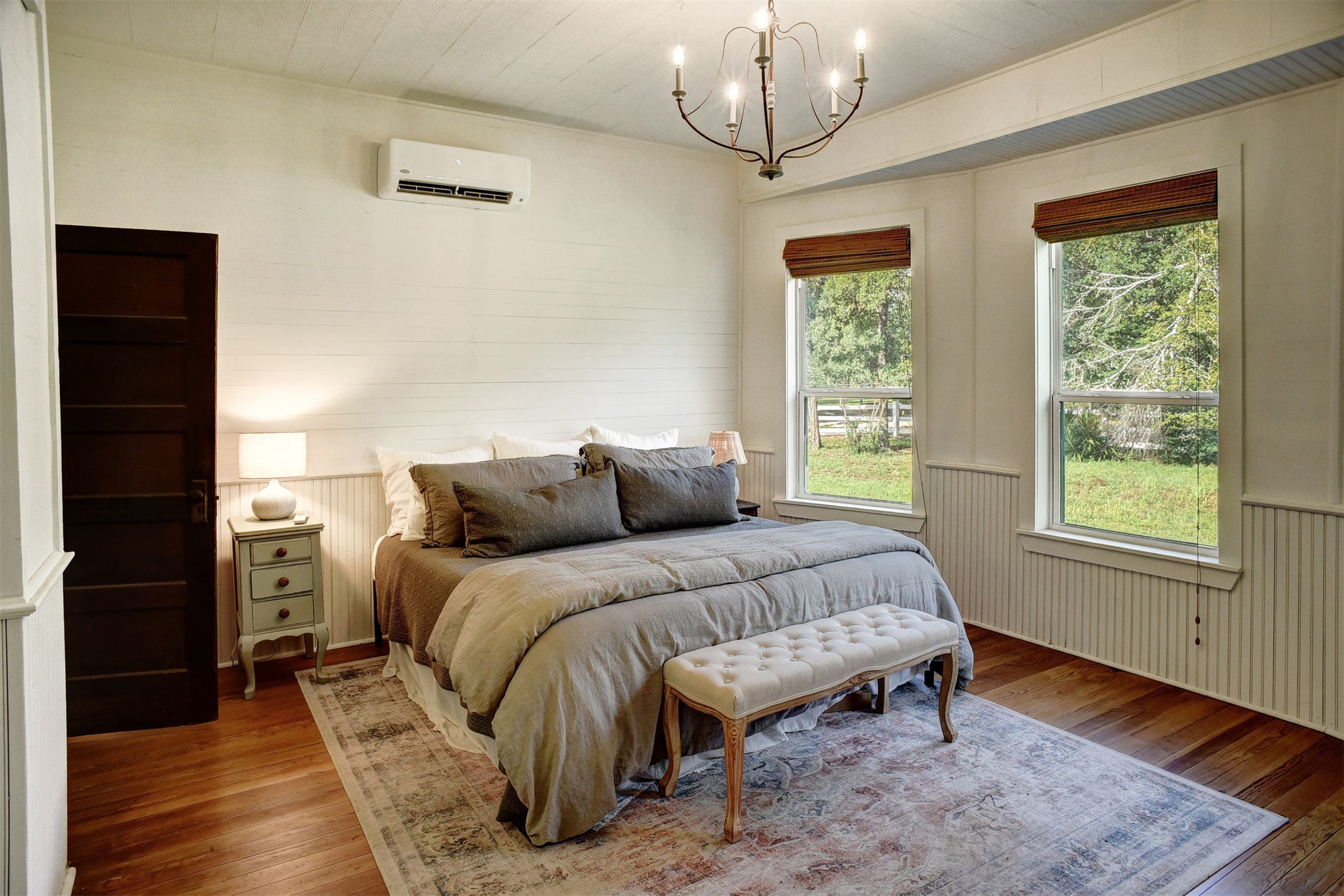 141 Grassyville Road Paige, TX 78659 - Photo 9 of 34 a spacious bedroom with a bed and a window