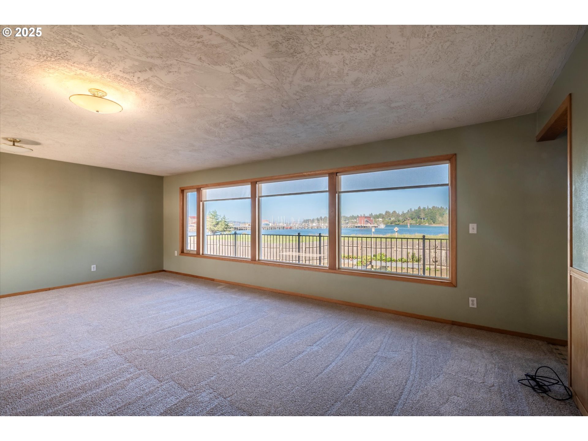 63347 Charleston Road Coos Bay, OR 97420 - Photo 14 of 48 a view of an empty room with a window