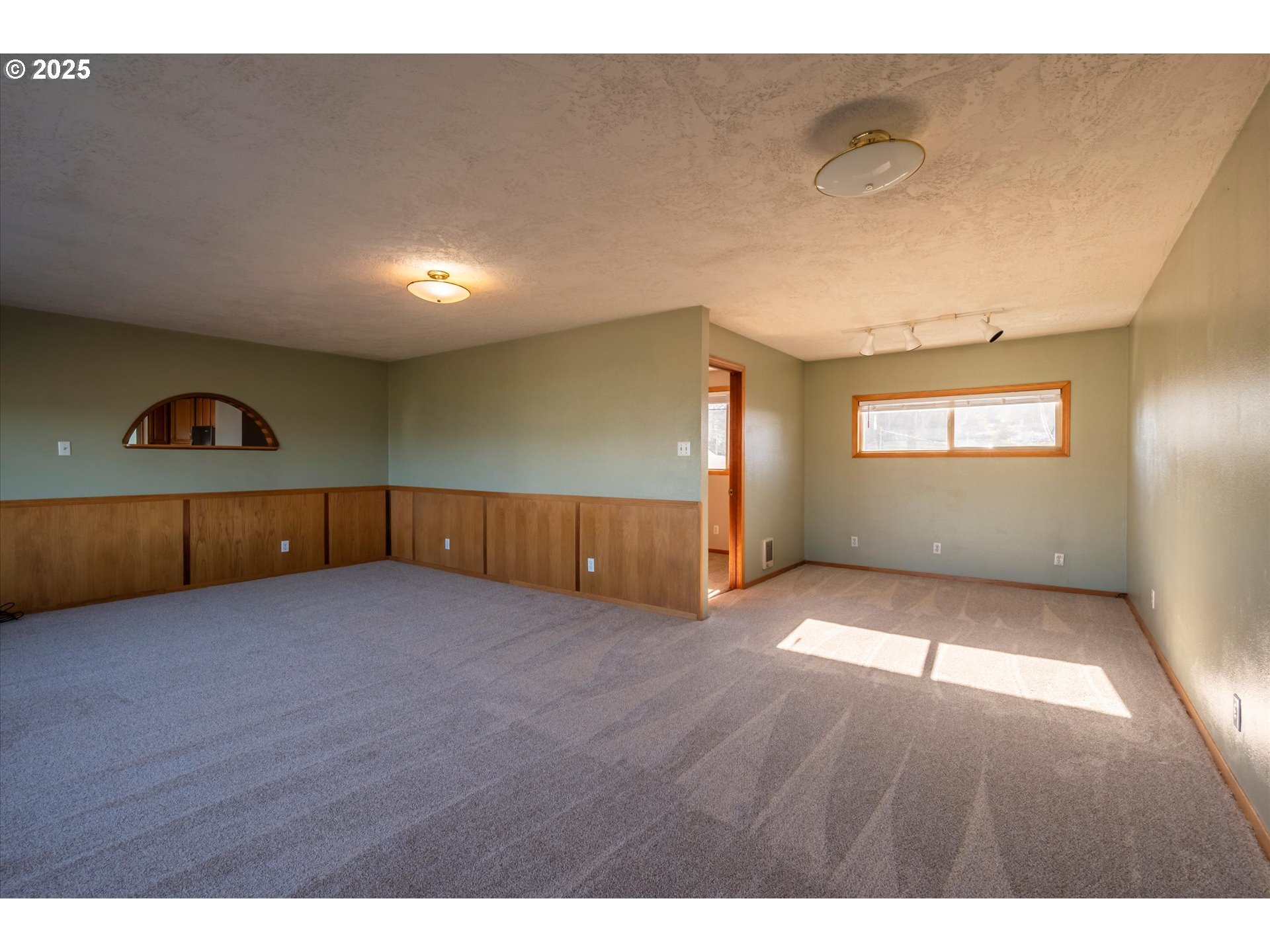 63347 Charleston Road Coos Bay, OR 97420 - Photo 20 of 48 a view of an empty room and window
