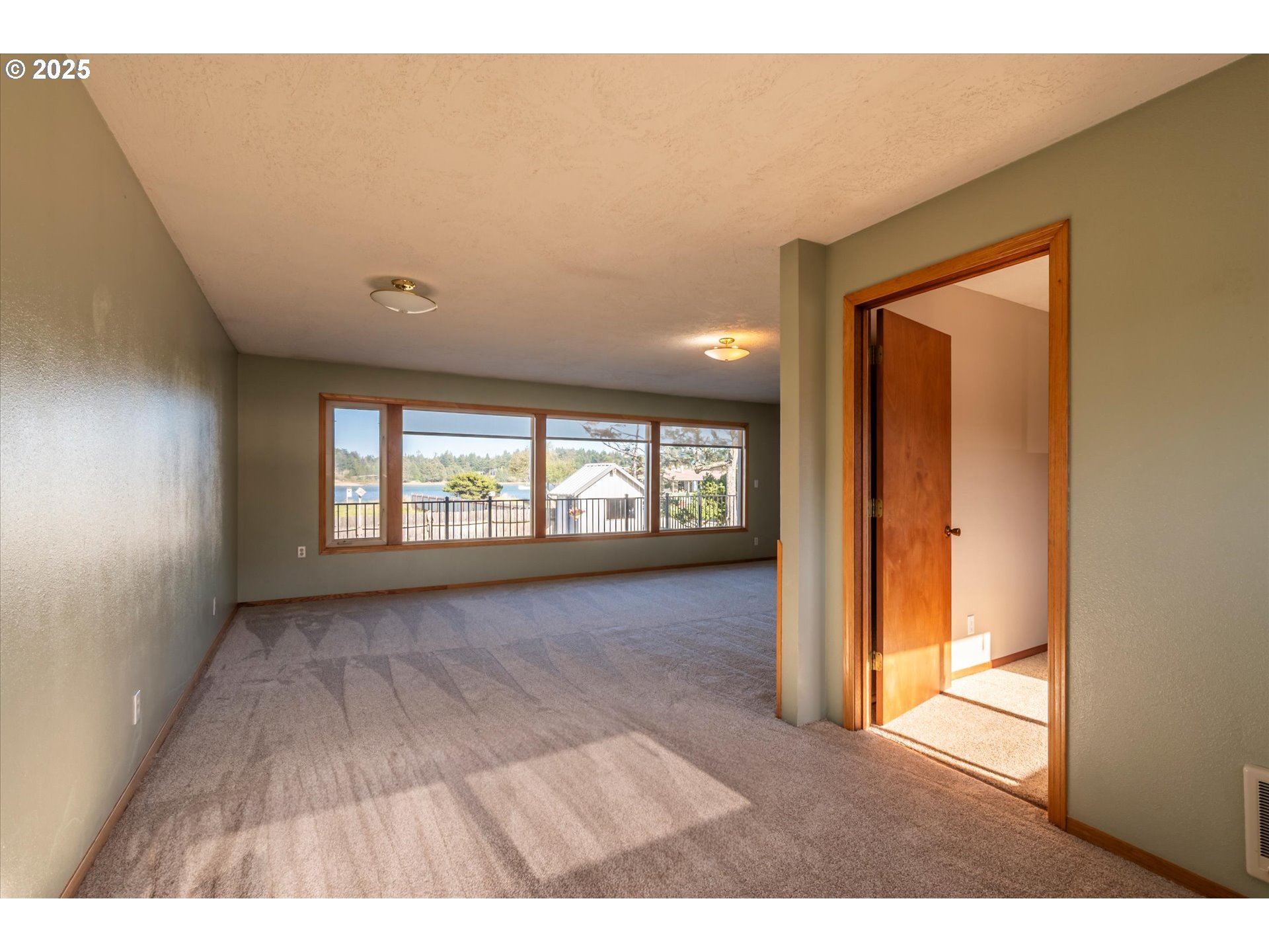 63347 Charleston Road Coos Bay, OR 97420 - Photo 21 of 48 a view interior of a house with wooden floor and windows