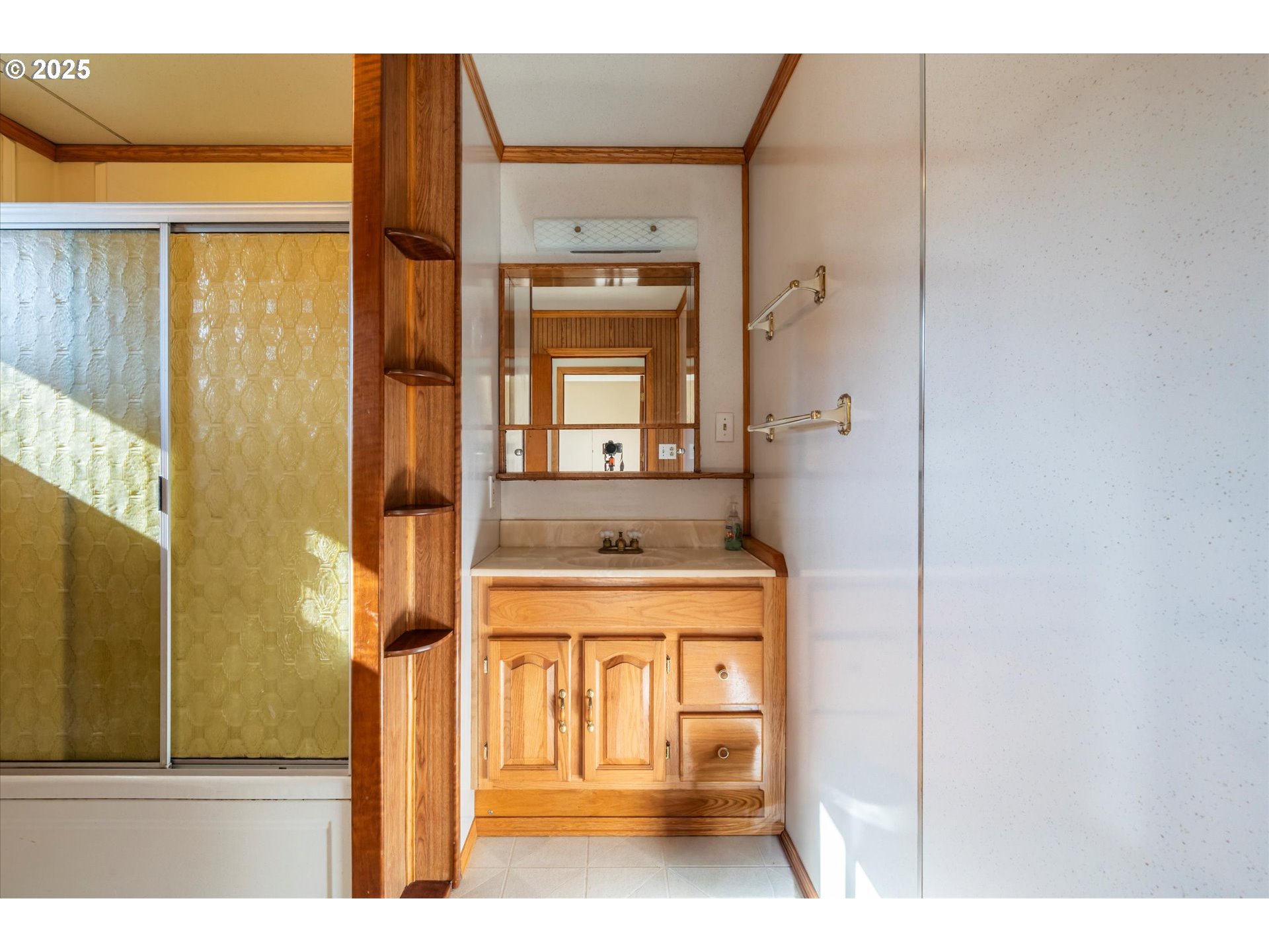 63347 Charleston Road Coos Bay, OR 97420 - Photo 25 of 48 a bathroom with a sink a mirror and a shower