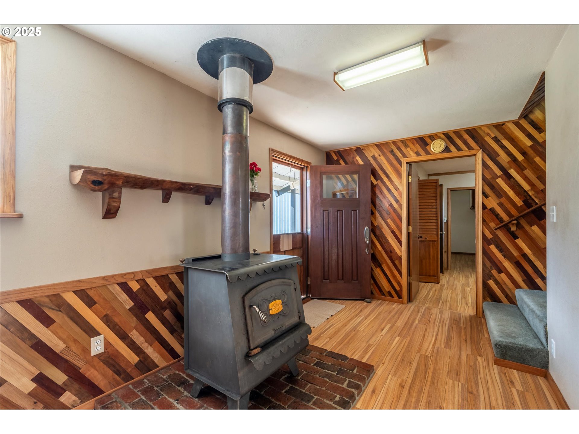 63347 Charleston Road Coos Bay, OR 97420 - Photo 31 of 48 a view of a living room and a fireplace