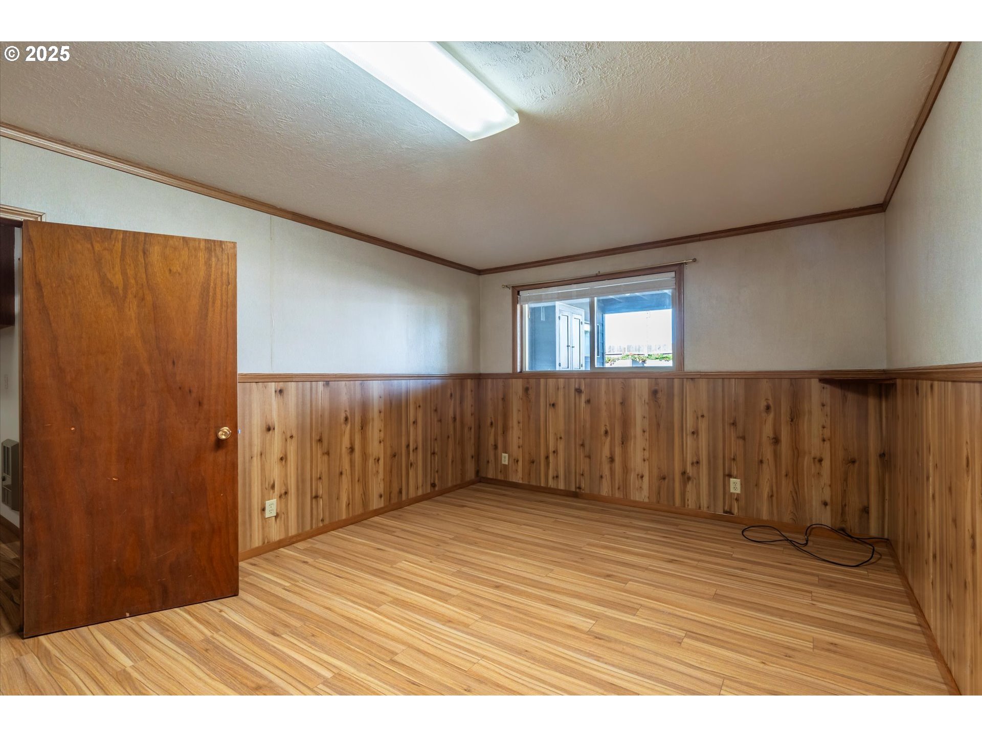 63347 Charleston Road Coos Bay, OR 97420 - Photo 32 of 48 view of wooden floor and windows in a room