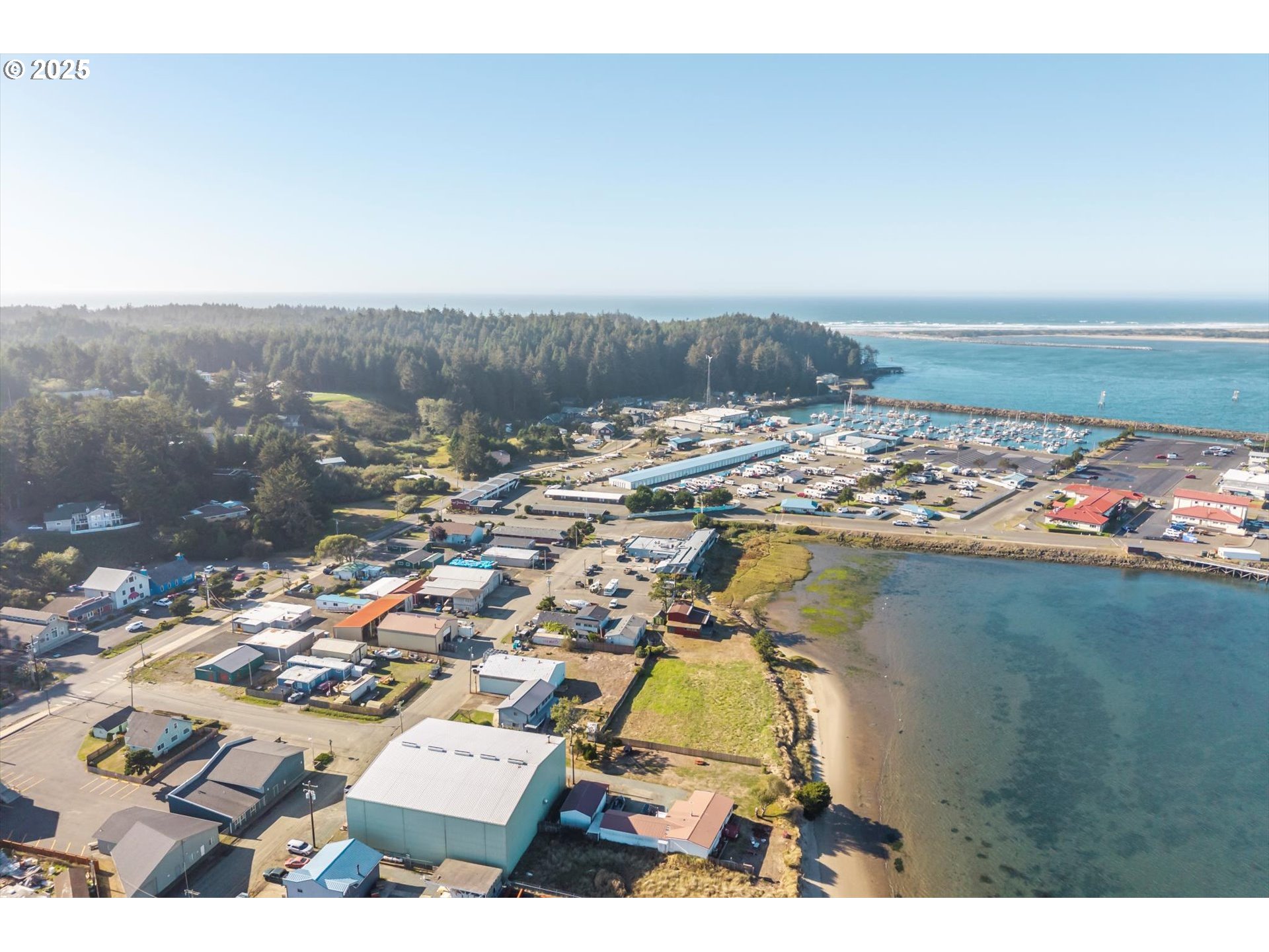63347 Charleston Road Coos Bay, OR 97420 - Photo 44 of 48 an aerial view of residential houses with outdoor space