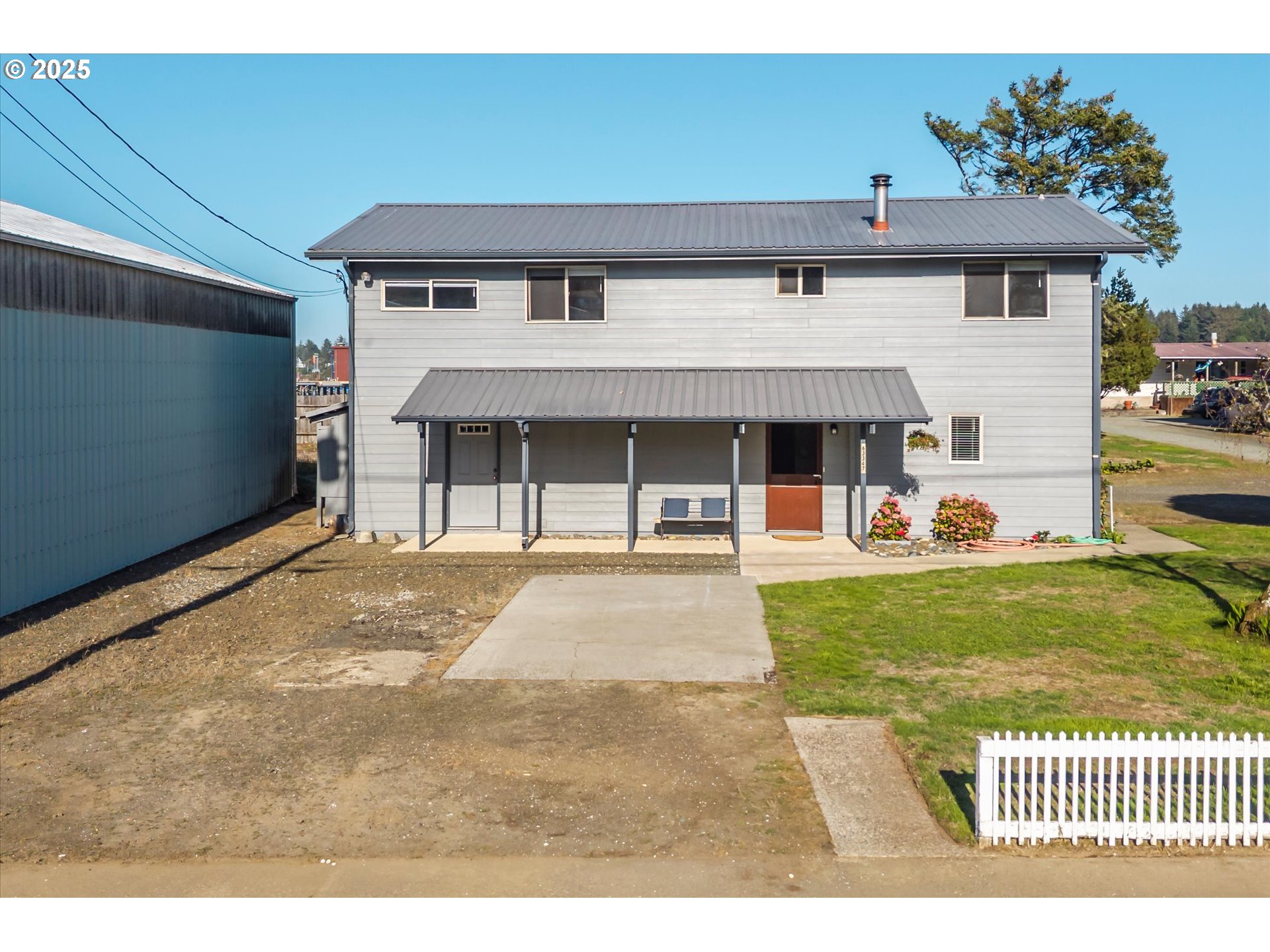 63347 Charleston Road Coos Bay, OR 97420 - Photo 6 of 48 a view of a house with a yard