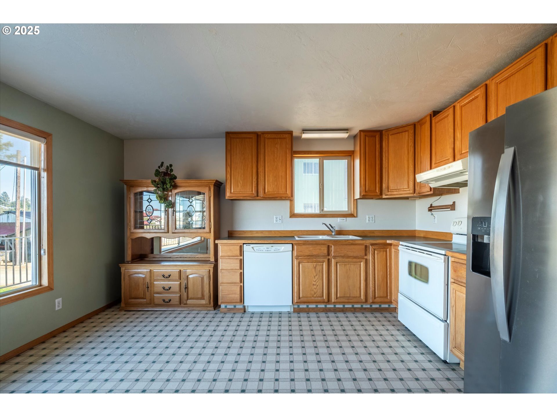 63347 Charleston Road Coos Bay, OR 97420 - Photo 8 of 48 a kitchen with stainless steel appliances a refrigerator sink and cabinets