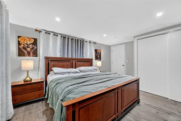 a bedroom with bed and tv