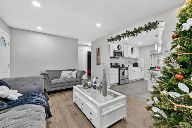 a living room with furniture and flowers
