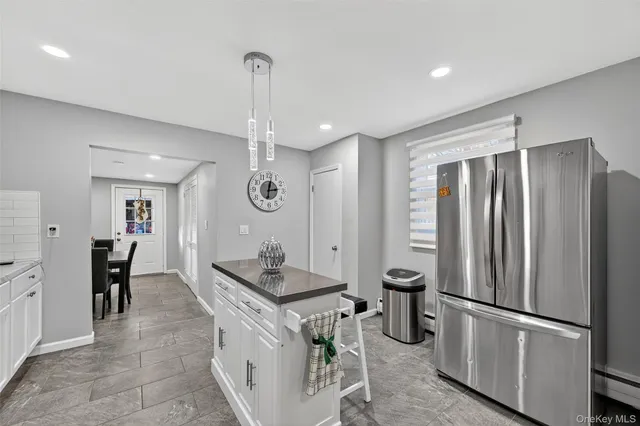 a kitchen with refrigerator cabinets and furniture