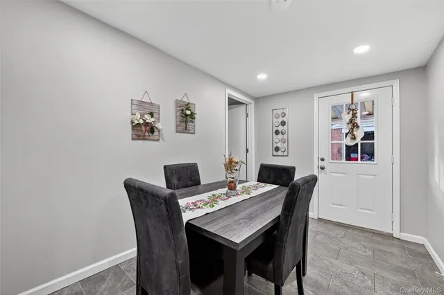 a bedroom with a bed and a lamp