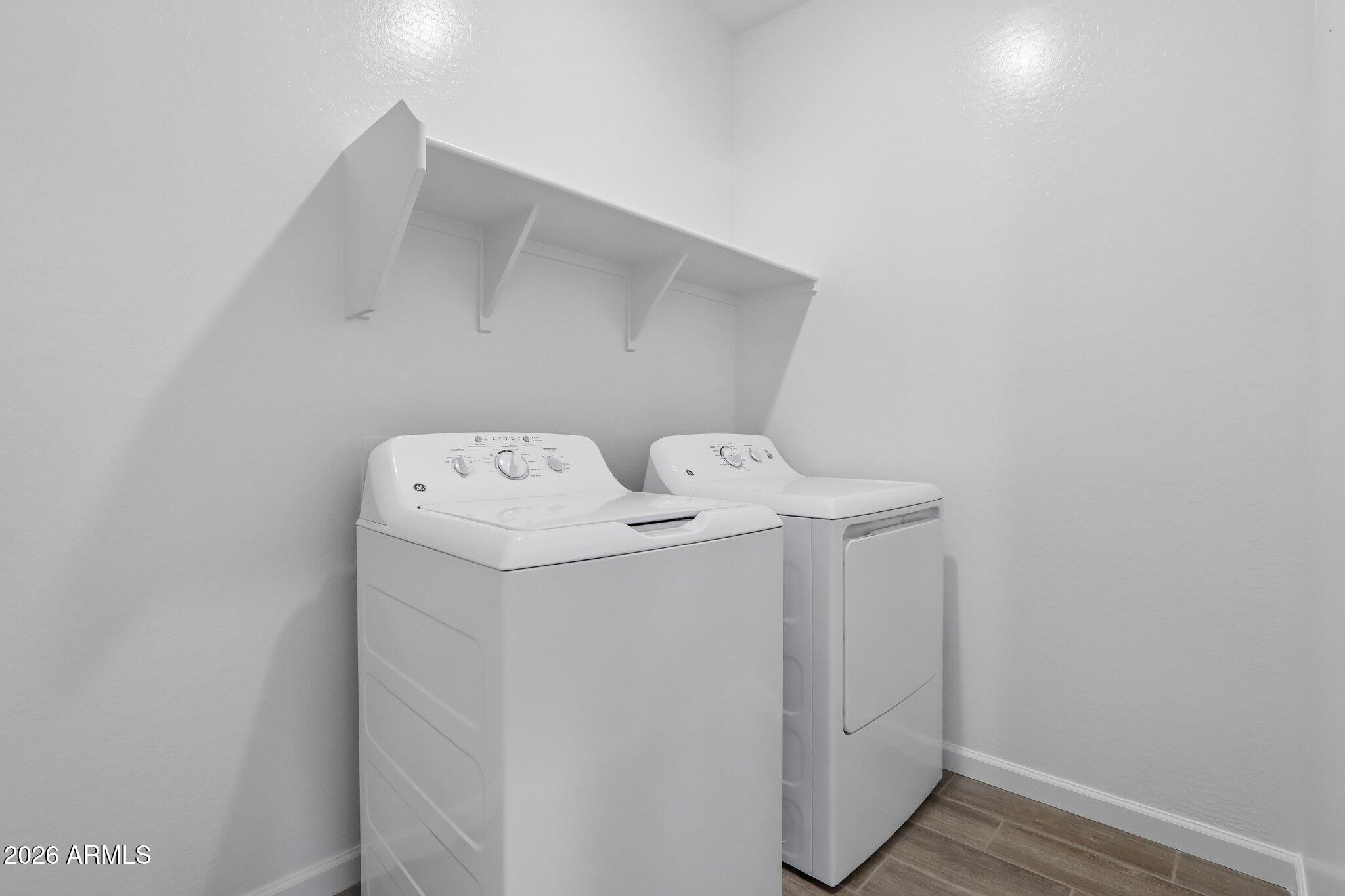 9544 West Gaby Road Tolleson, AZ 85353 - Photo 21 of 43 a utility room with dryer and washer
