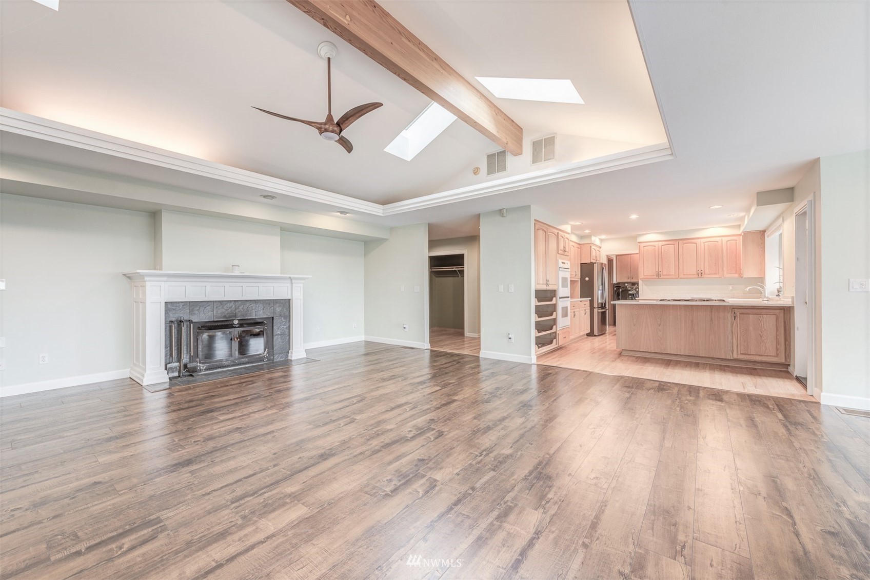 10029 Wagner Road Snohomish, WA 98290 - Photo 12 of 40 a view of a room with wooden floor and a kitchen