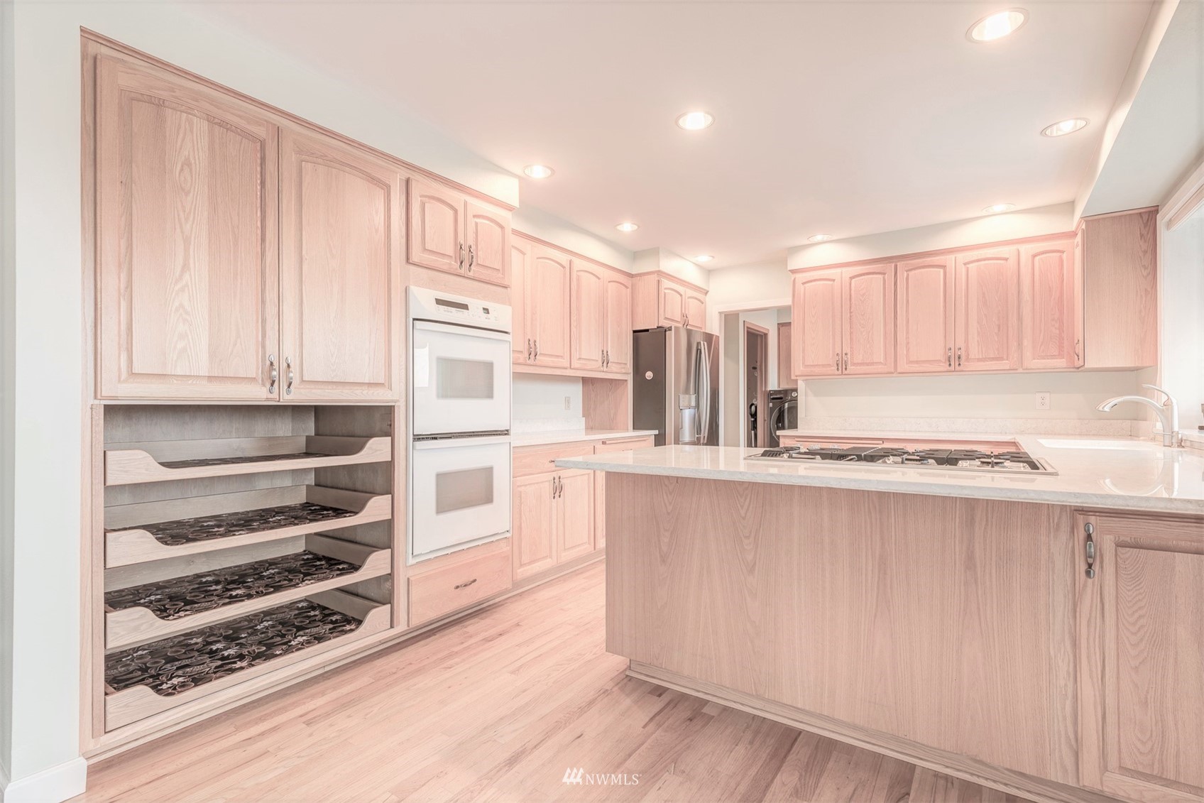 10029 Wagner Road Snohomish, WA 98290 - Photo 15 of 40 a kitchen with stainless steel appliances a stove a microwave and white cabinets