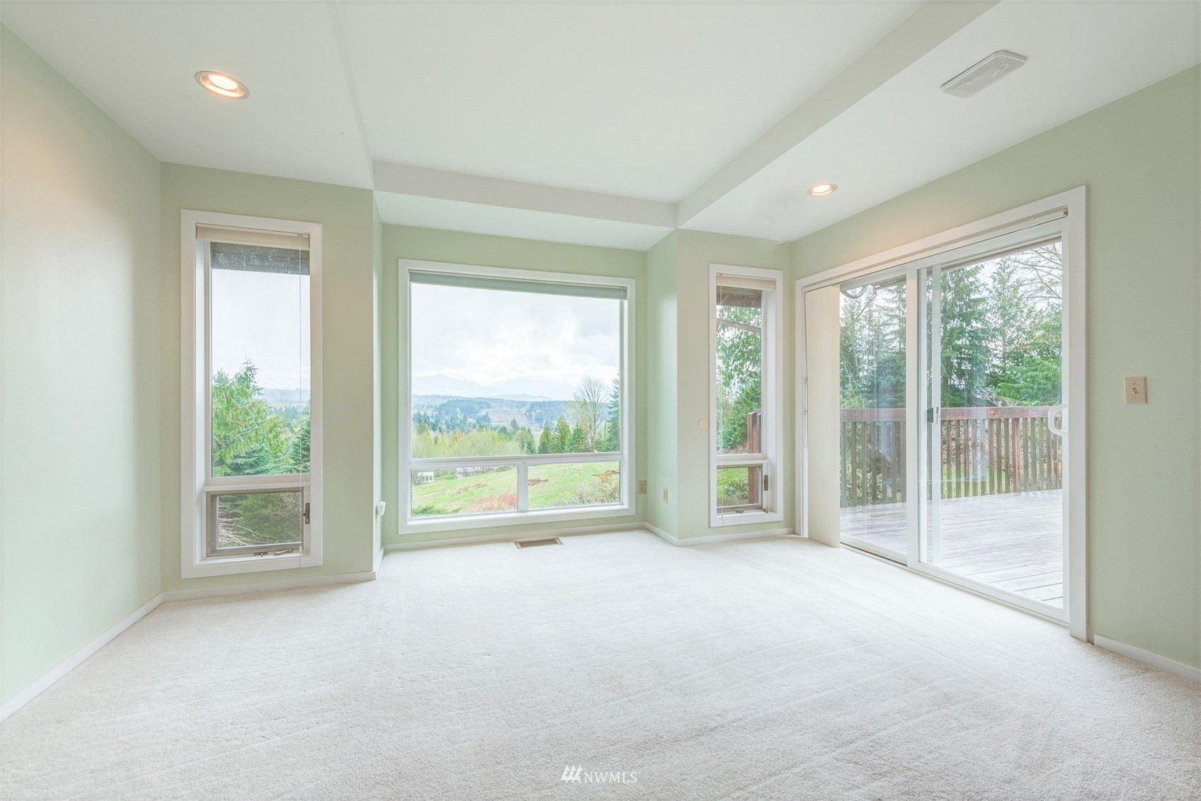 10029 Wagner Road Snohomish, WA 98290 - Photo 19 of 40 a view of an empty room with wooden floor and next to a window