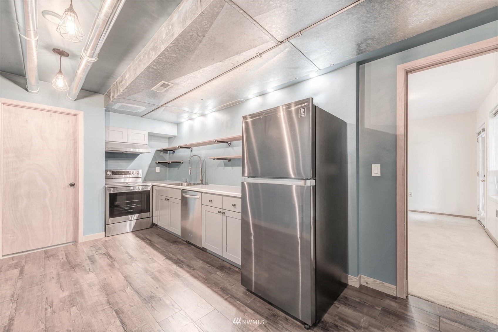 10029 Wagner Road Snohomish, WA 98290 - Photo 25 of 40 a kitchen with stainless steel appliances a refrigerator and a stove