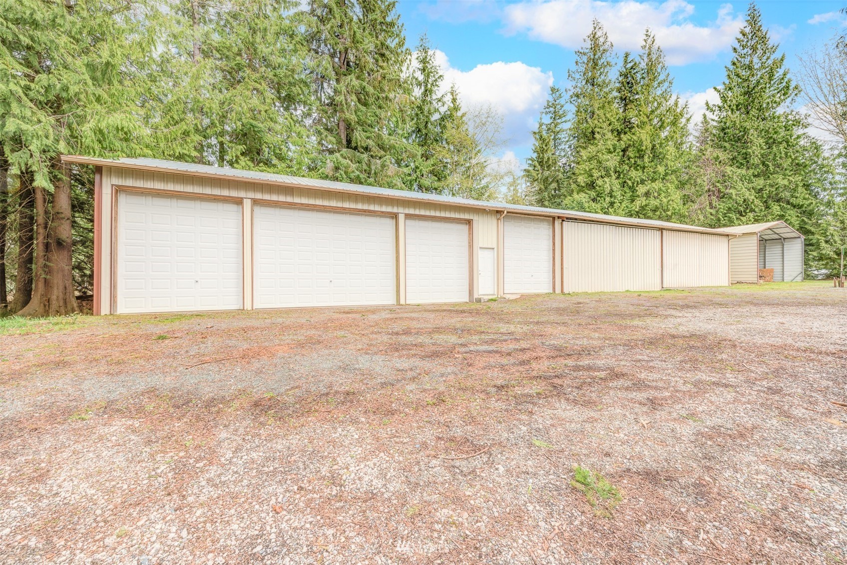 10029 Wagner Road Snohomish, WA 98290 - Photo 32 of 40 a view of an house with backyard and trees