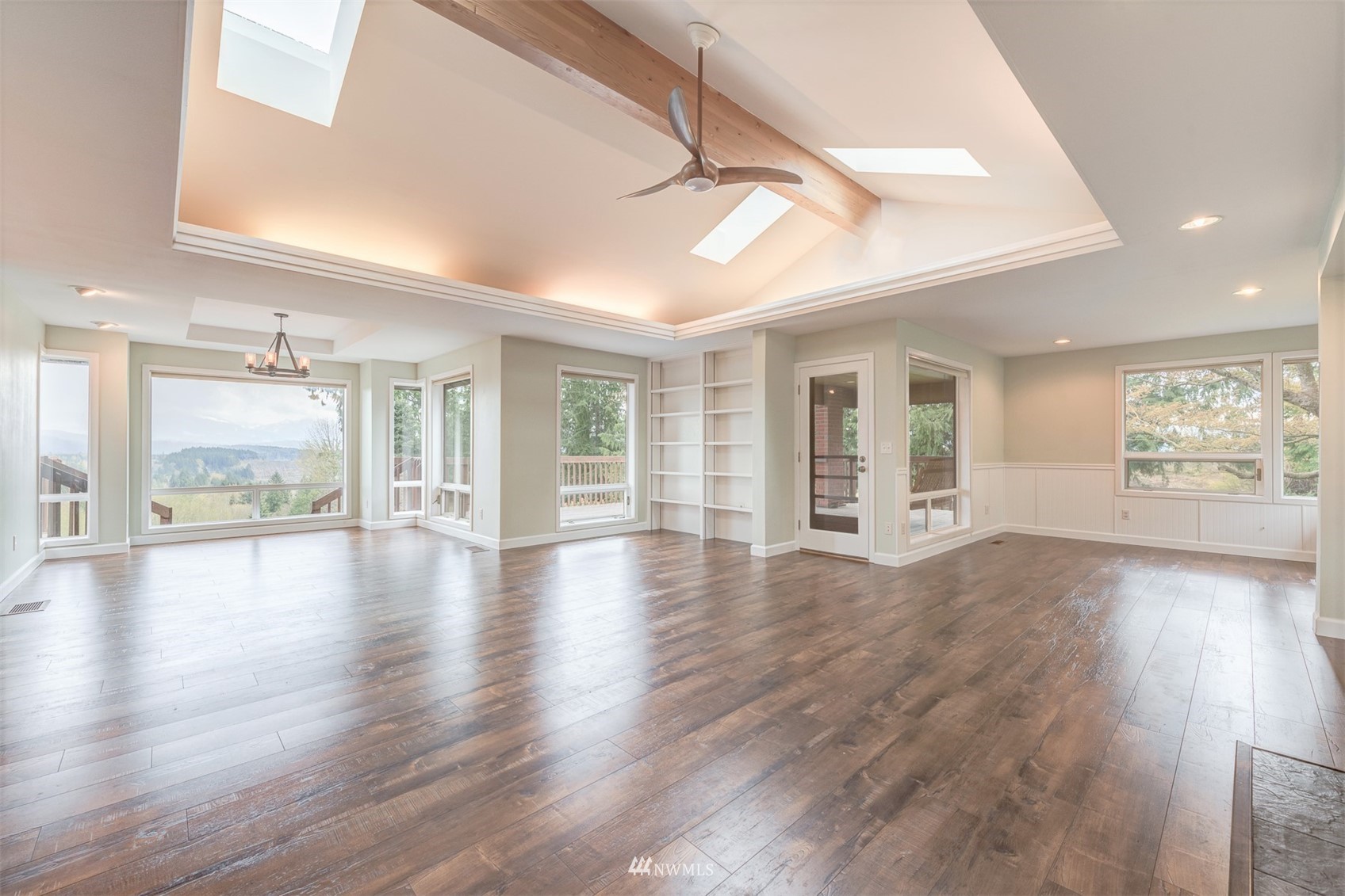 10029 Wagner Road Snohomish, WA 98290 - Photo 7 of 40 a view of an empty room with wooden floor and a window
