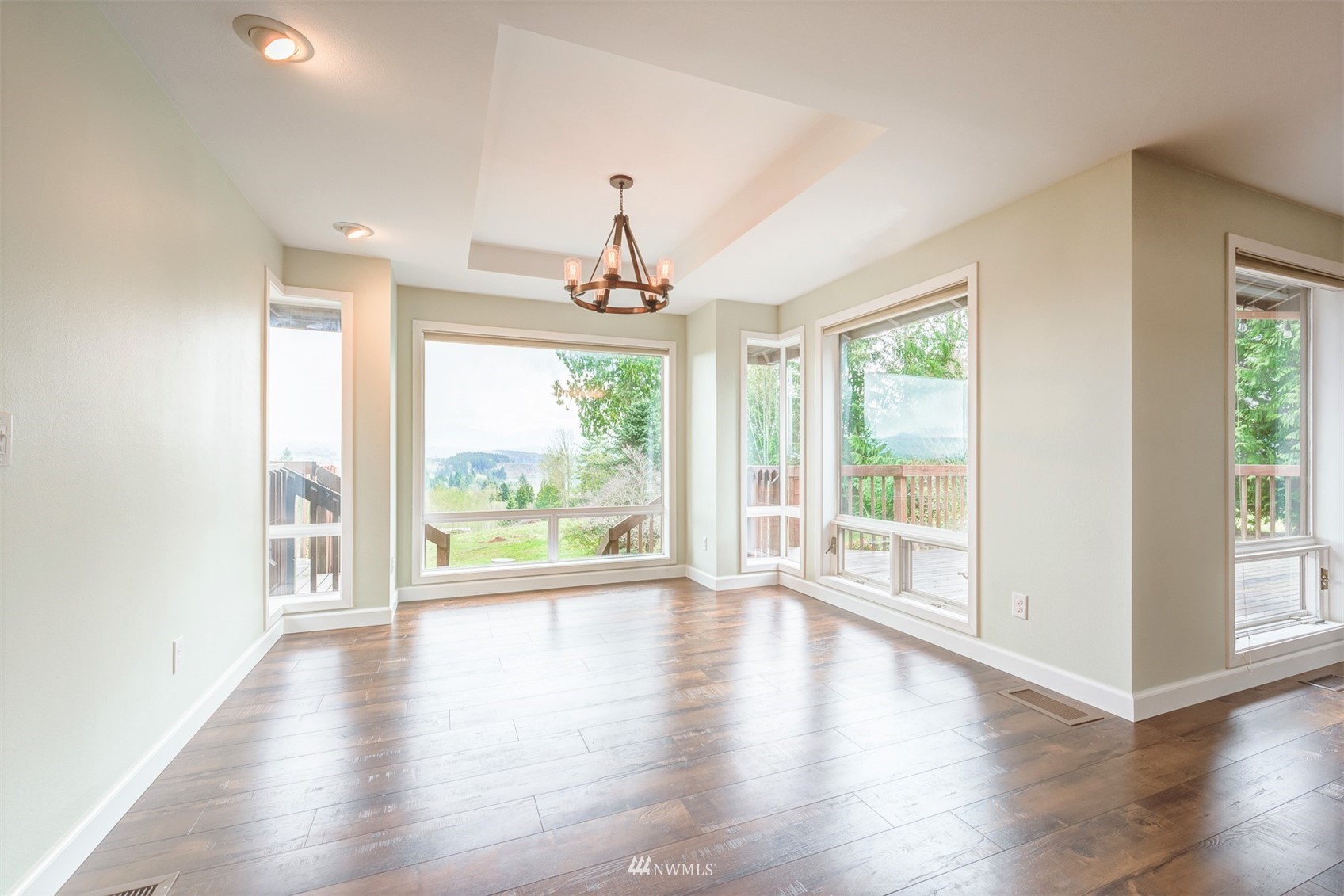 10029 Wagner Road Snohomish, WA 98290 - Photo 9 of 40 a view of an empty room with wooden floor and a window