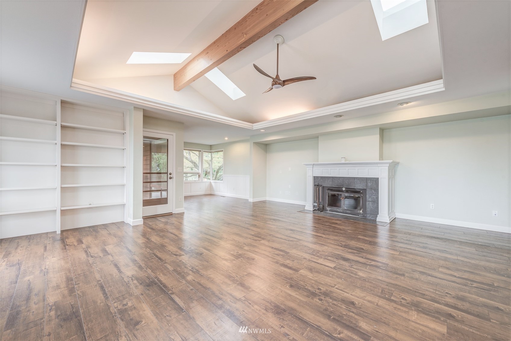 10029 Wagner Road Snohomish, WA 98290 - Photo 10 of 40 a view of empty room with wooden floor and fireplace