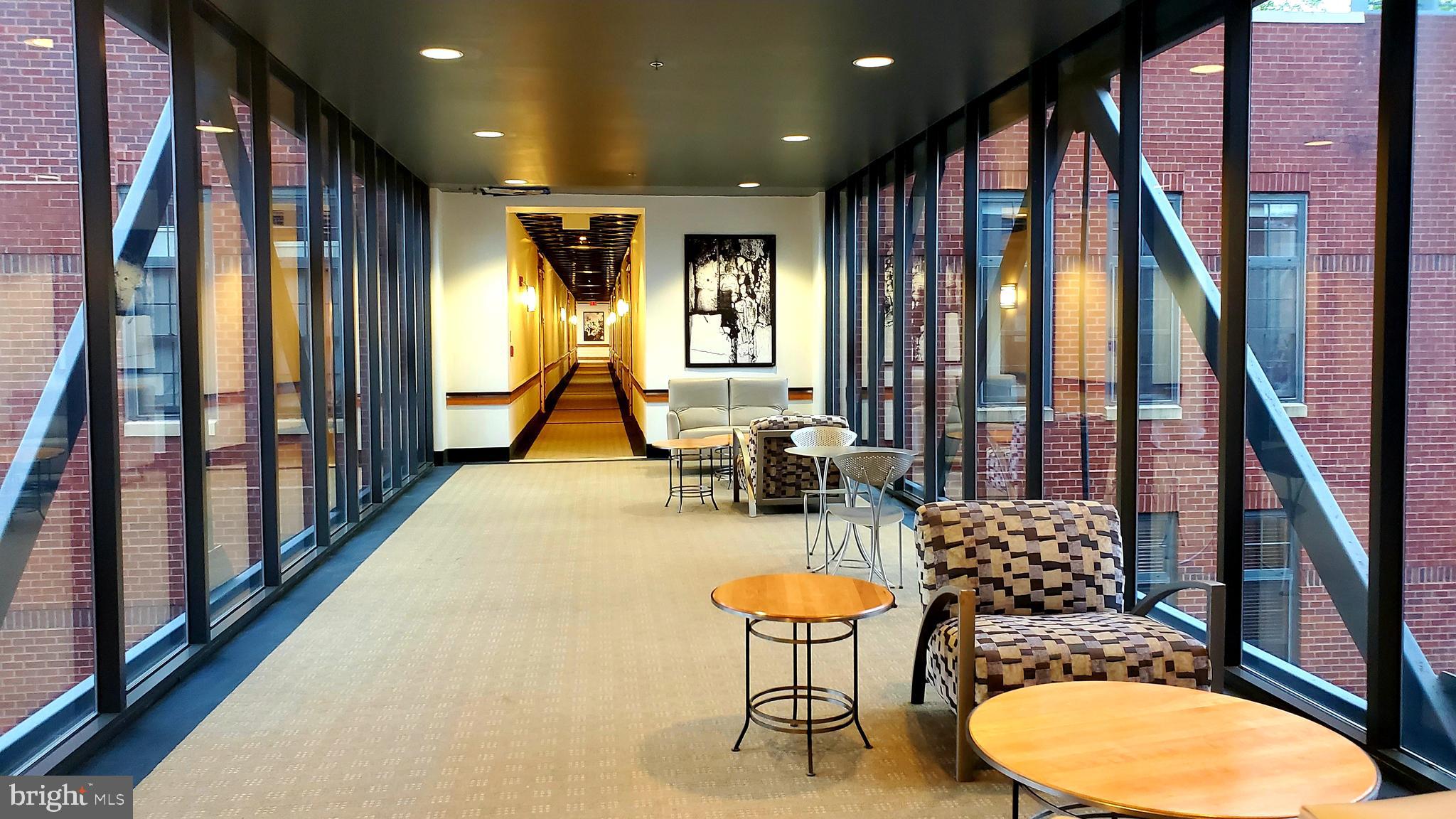 2328 Champlain Street Northwest, Unit 424 Washington, DC 20009 - Photo 6 of 23 Glass bridge in hallway of building