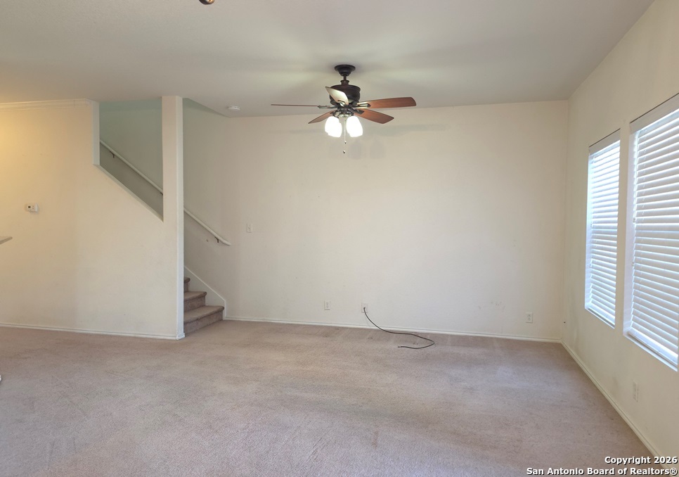 3907 Paradiso Loop San Antonio, TX 78260 - Photo 11 of 30 an empty room with a window and a ceiling fan