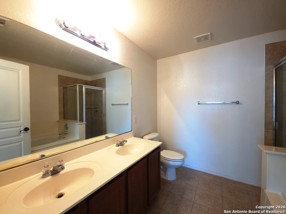 3907 Paradiso Loop San Antonio, TX 78260 - Photo 17 of 30 a bathroom with a sink and a mirror