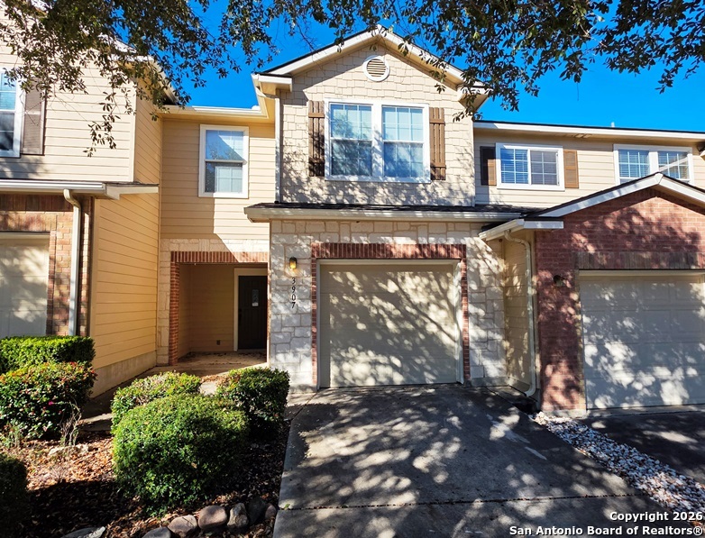 3907 Paradiso Loop San Antonio, TX 78260 - Photo 2 of 30 a front view of a house with a yard