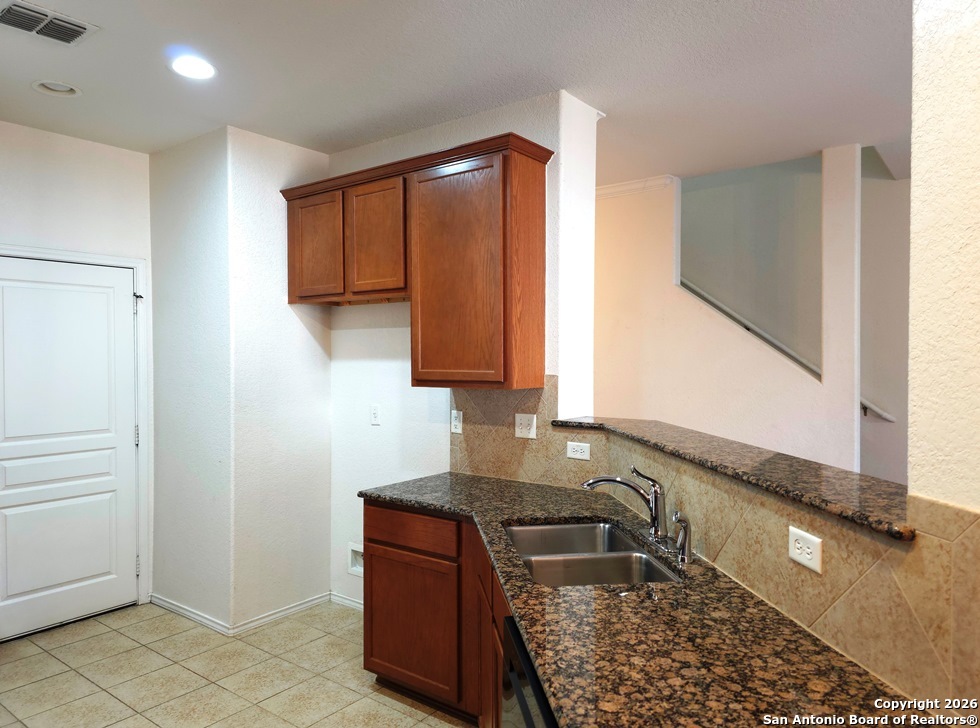 3907 Paradiso Loop San Antonio, TX 78260 - Photo 8 of 30 a bathroom with sink a mirror and vanity