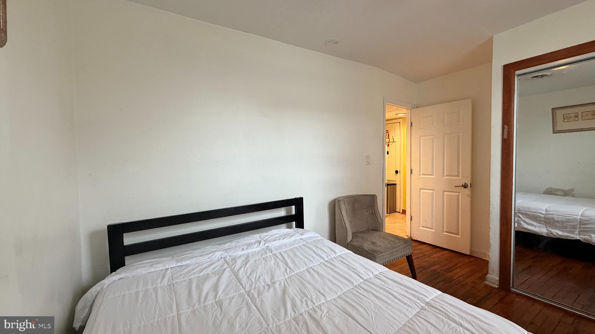 830 19th Street Northeast Washington, DC 20002 - Photo 13 of 13 a bedroom with a bed and wooden floor