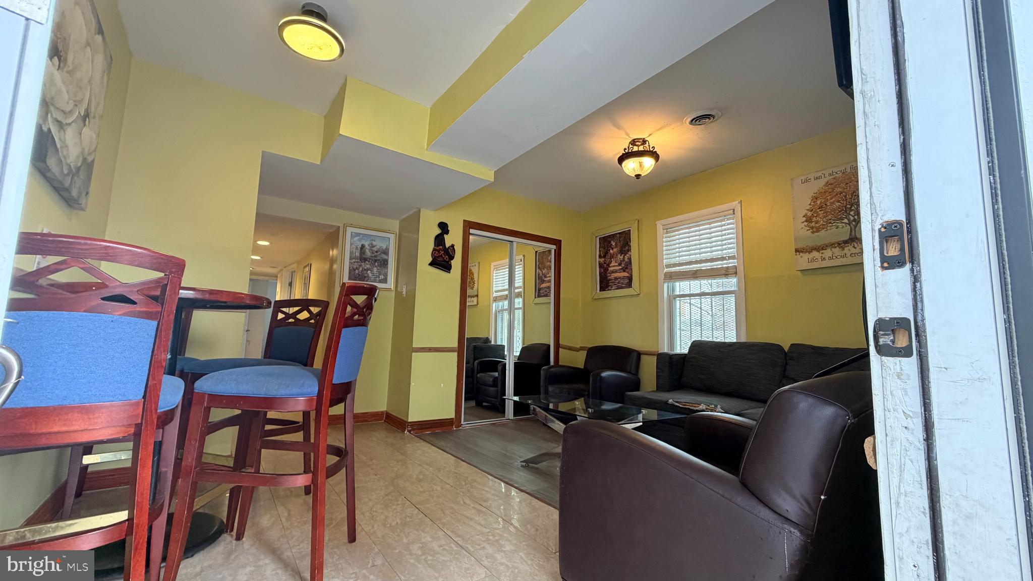 830 19th Street Northeast Washington, DC 20002 - Photo 2 of 13 a living room with furniture and a lamp