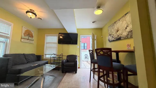 a living room with furniture fireplace and a flat screen tv