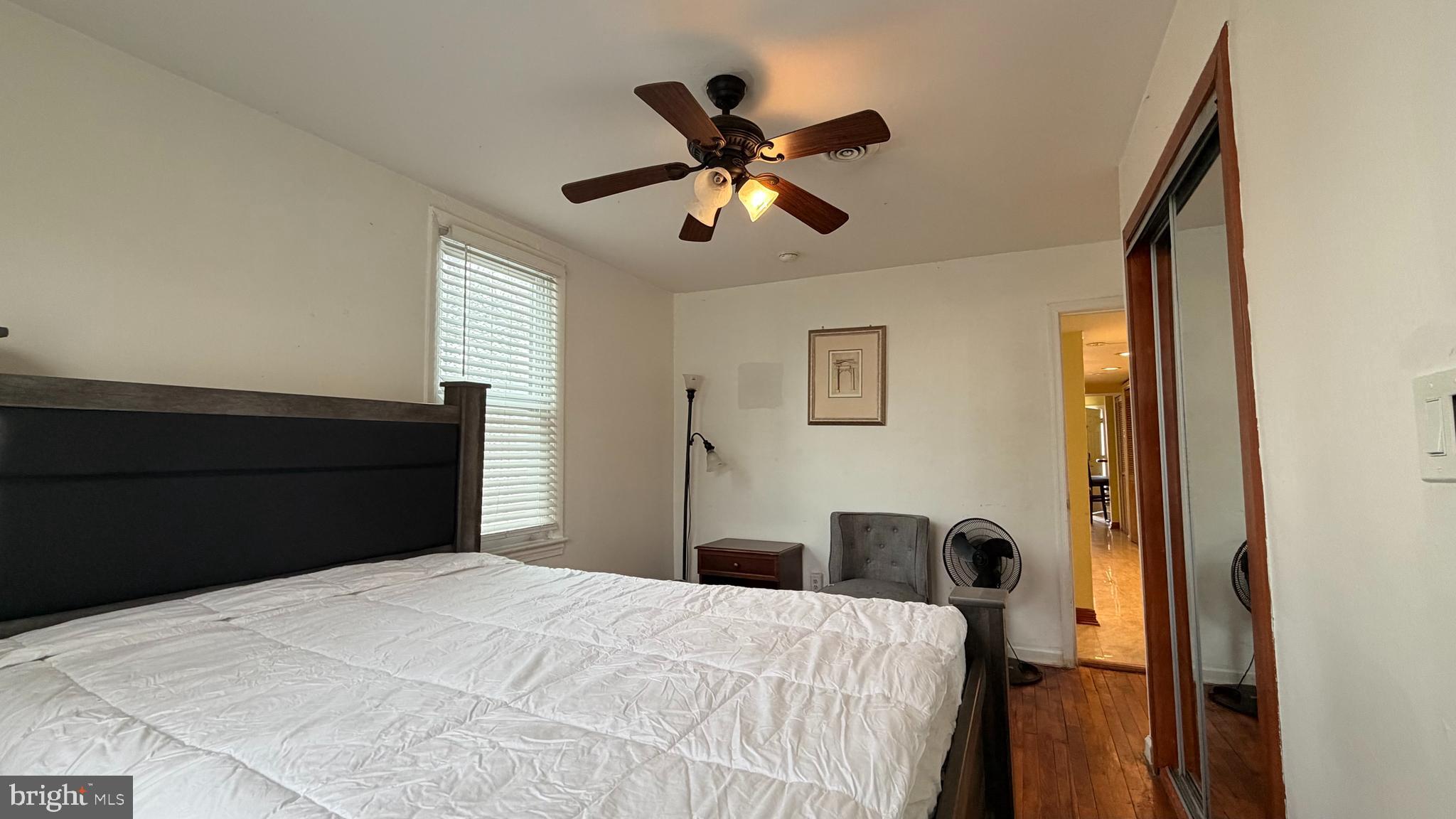830 19th Street Northeast Washington, DC 20002 - Photo 8 of 13 a bedroom with a bed and a chandelier
