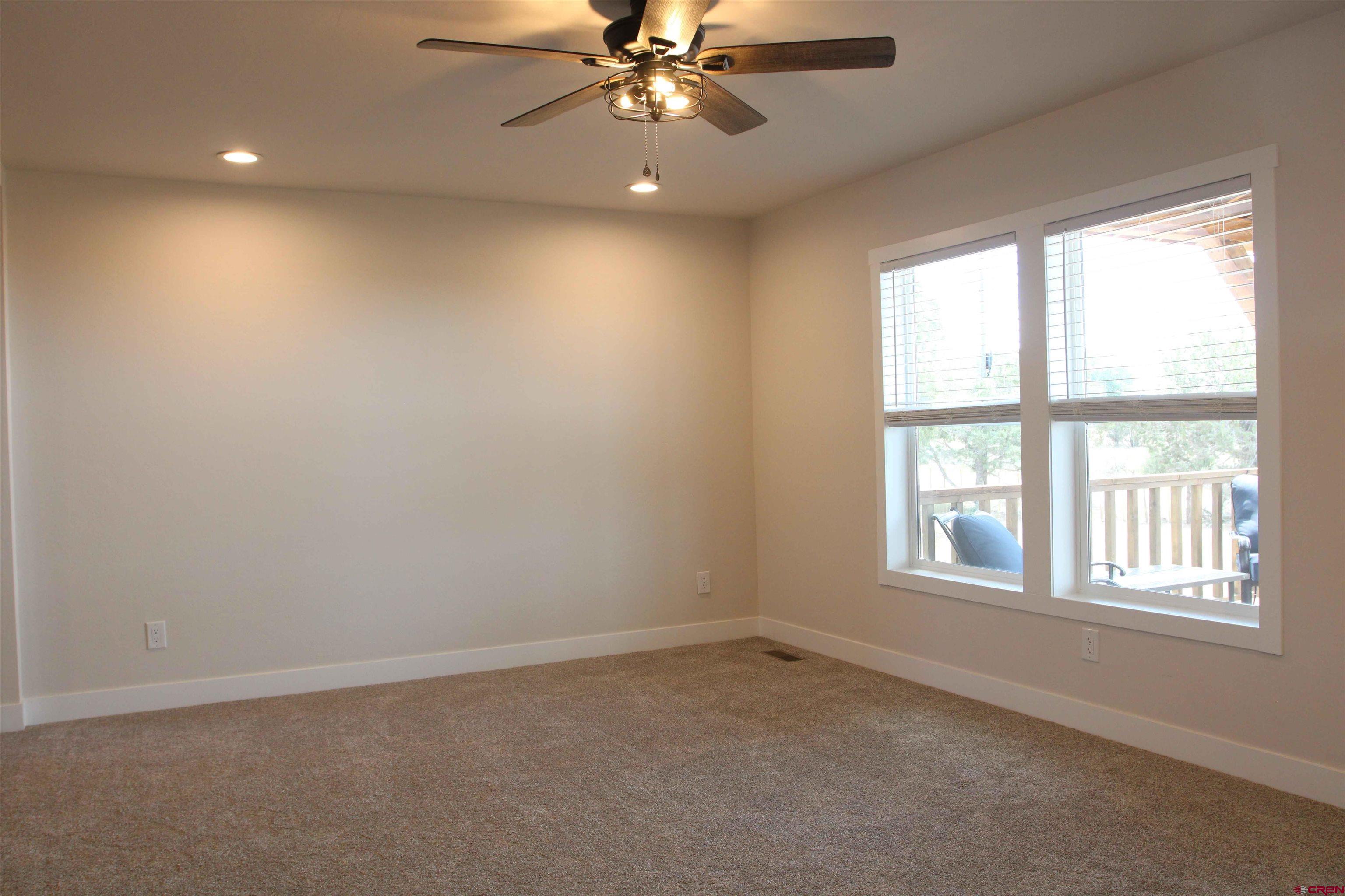 29173 P 50 Road Hotchkiss, CO 81419 - Photo 11 of 38 an empty room with a window and a fan