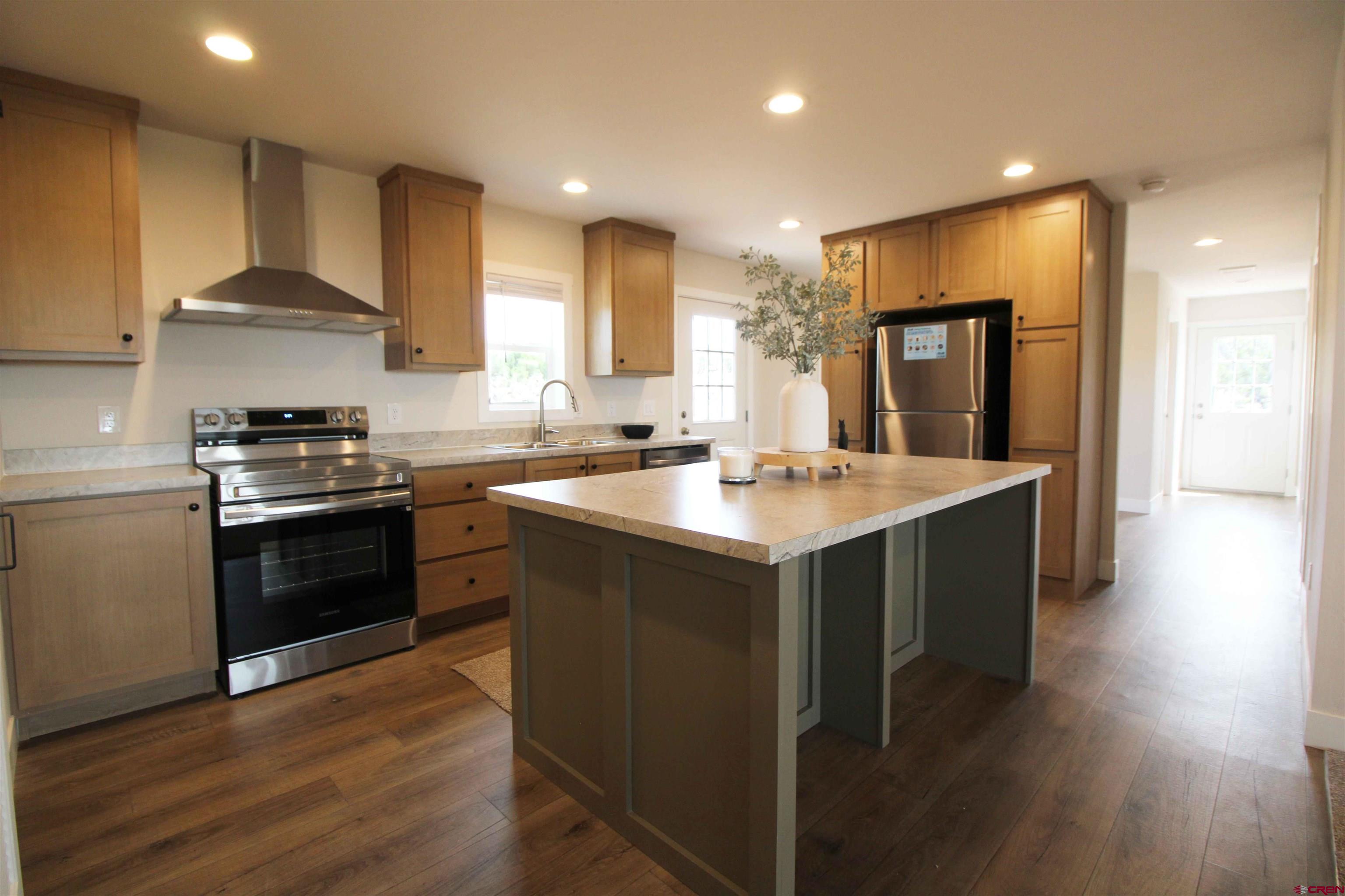 29173 P 50 Road Hotchkiss, CO 81419 - Photo 18 of 38 a kitchen with a sink cabinets and wooden floor