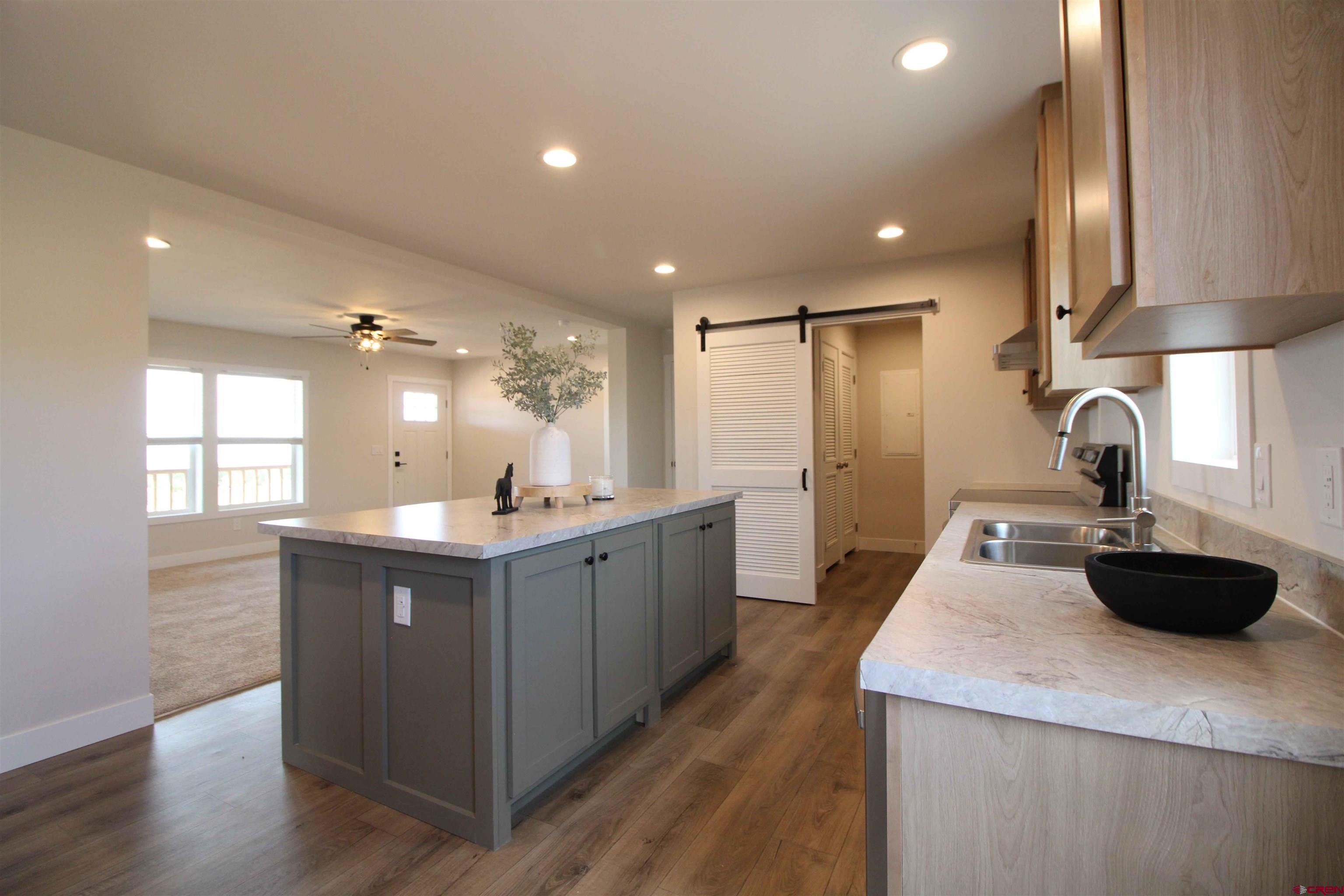 29173 P 50 Road Hotchkiss, CO 81419 - Photo 20 of 38 a kitchen with kitchen island a sink appliances and cabinets