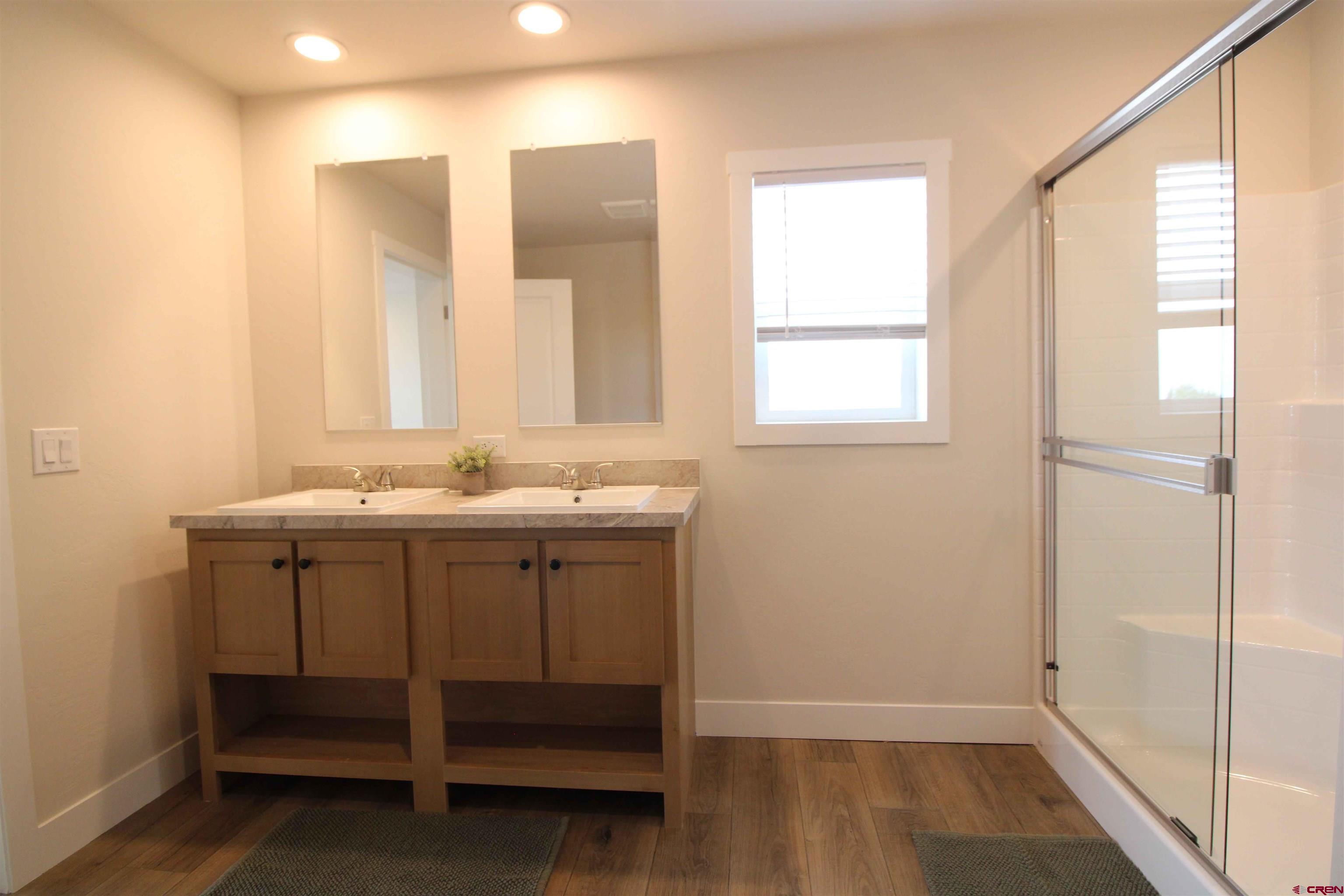 29173 P 50 Road Hotchkiss, CO 81419 - Photo 2 of 38 a bathroom with a sink a mirror and a shower