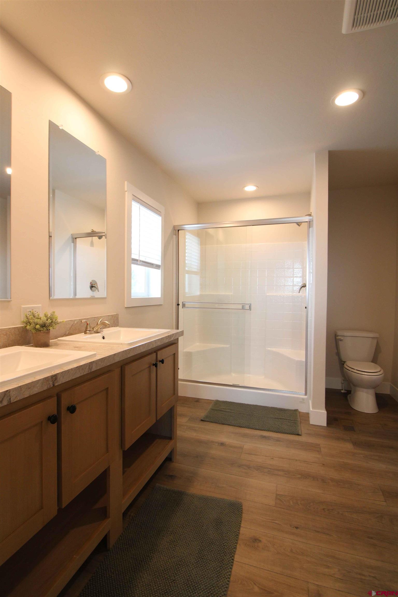 29173 P 50 Road Hotchkiss, CO 81419 - Photo 21 of 38 a bathroom with a granite countertop sink mirror and toilet