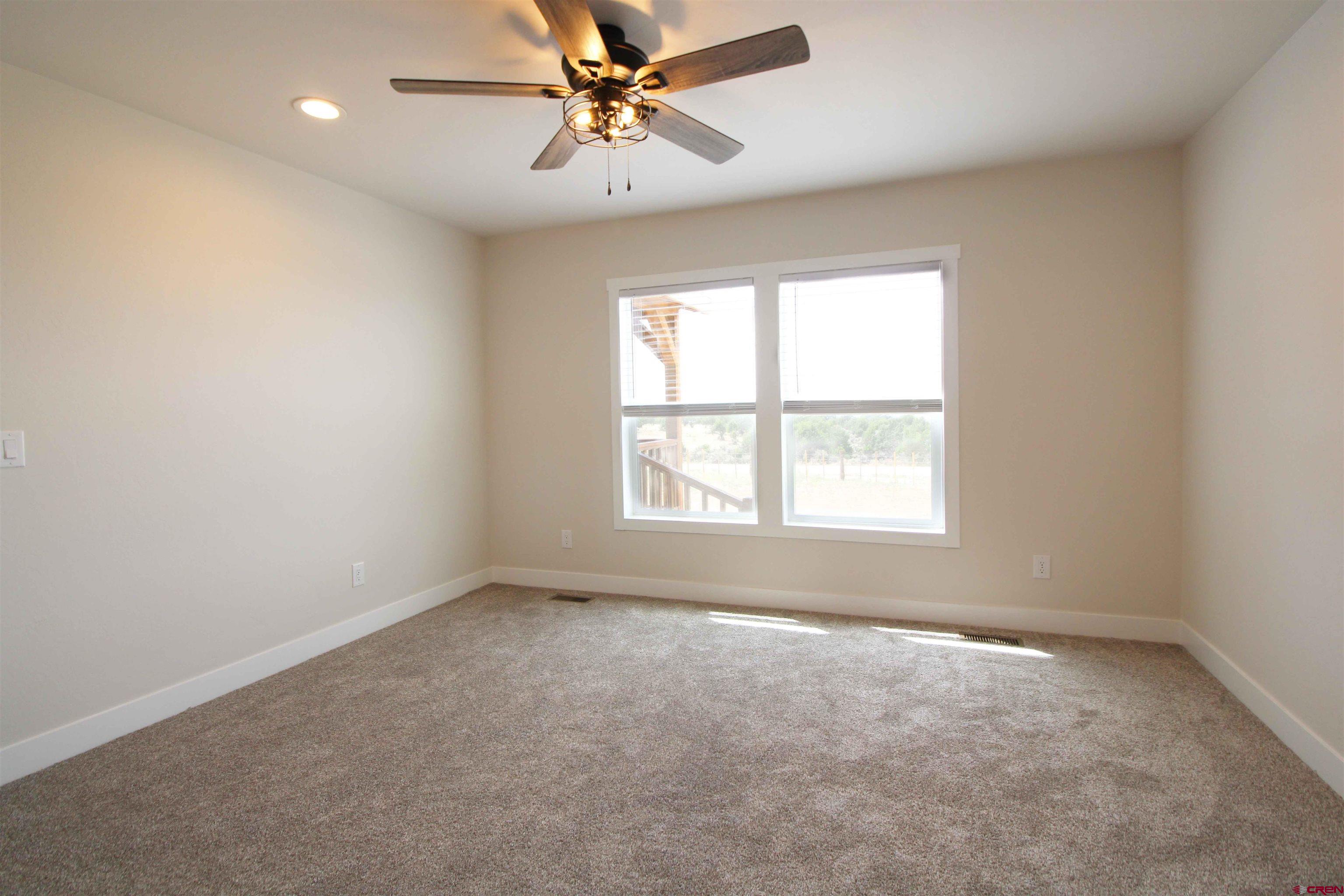 29173 P 50 Road Hotchkiss, CO 81419 - Photo 26 of 38 an empty room with a window and a fan