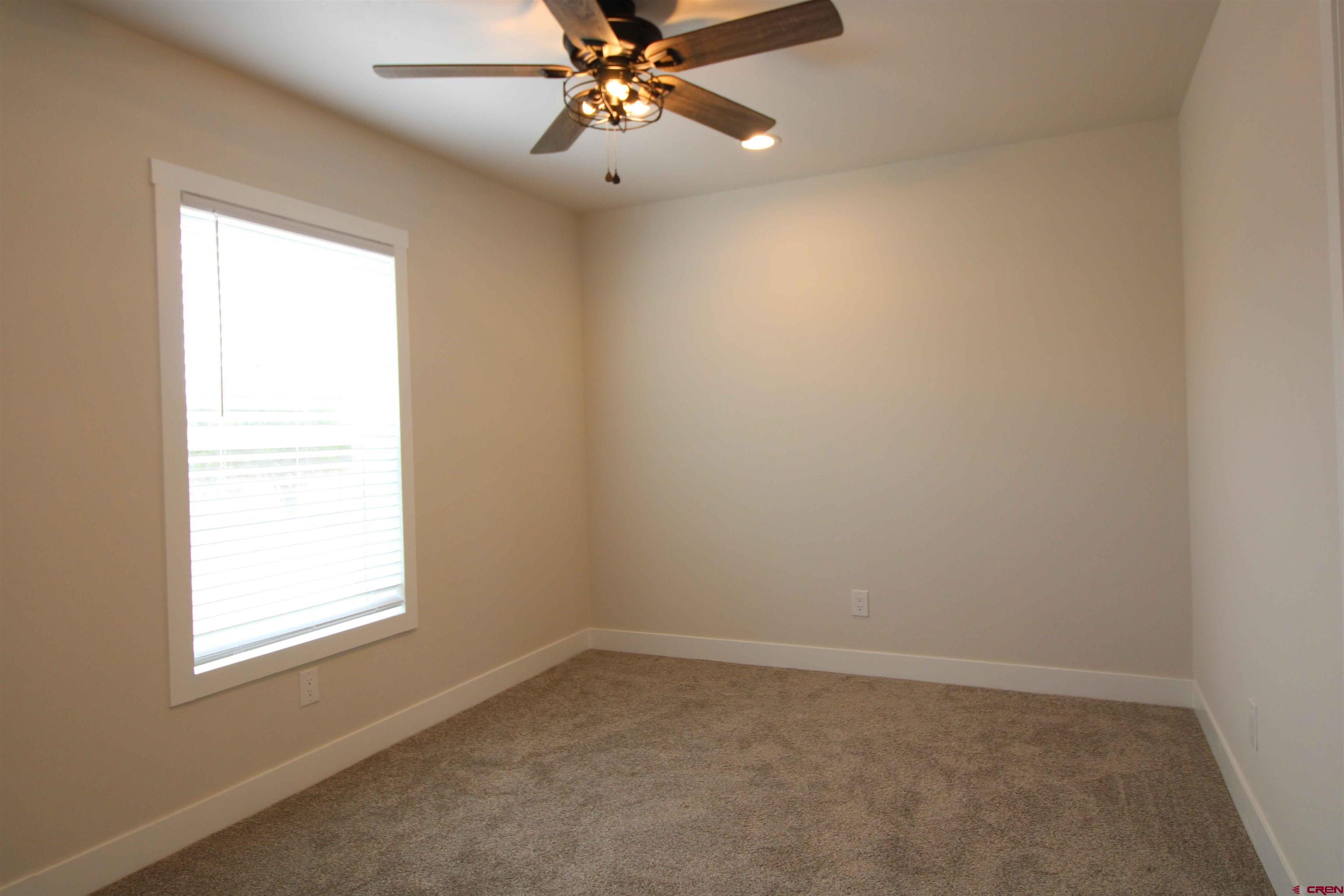 29173 P 50 Road Hotchkiss, CO 81419 - Photo 29 of 38 an empty room with a window and a fan