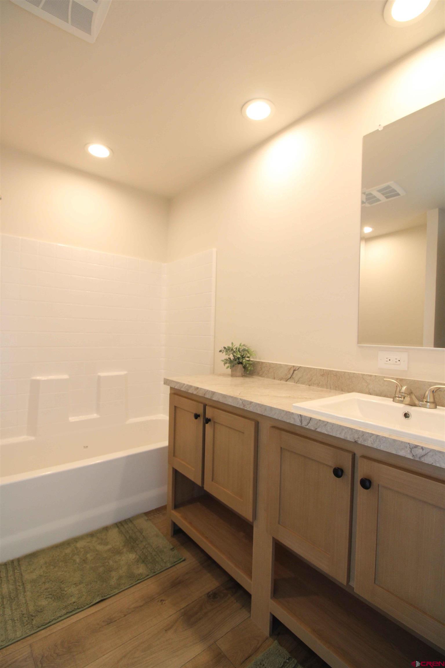29173 P 50 Road Hotchkiss, CO 81419 - Photo 3 of 38 a bathroom with a tub sink and mirror