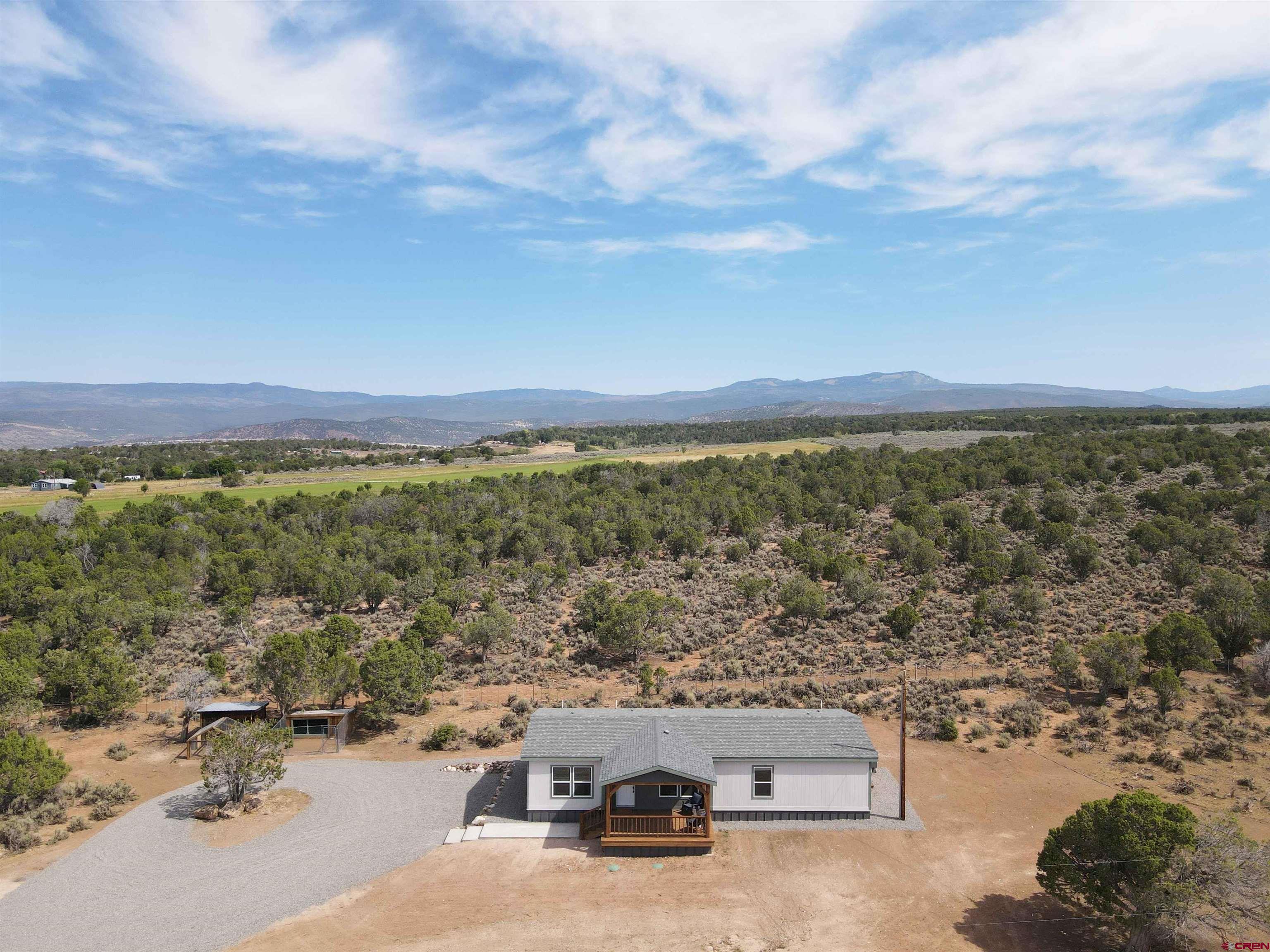 29173 P 50 Road Hotchkiss, CO 81419 - Photo 34 of 38 an aerial view of a city with lots of residential buildings