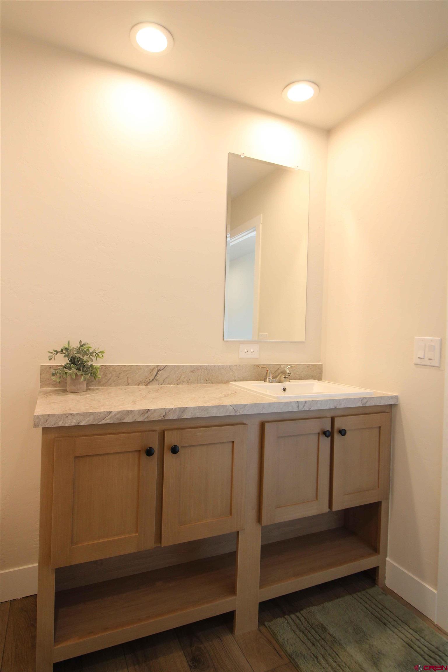 29173 P 50 Road Hotchkiss, CO 81419 - Photo 4 of 38 a bathroom with a sink and a mirror