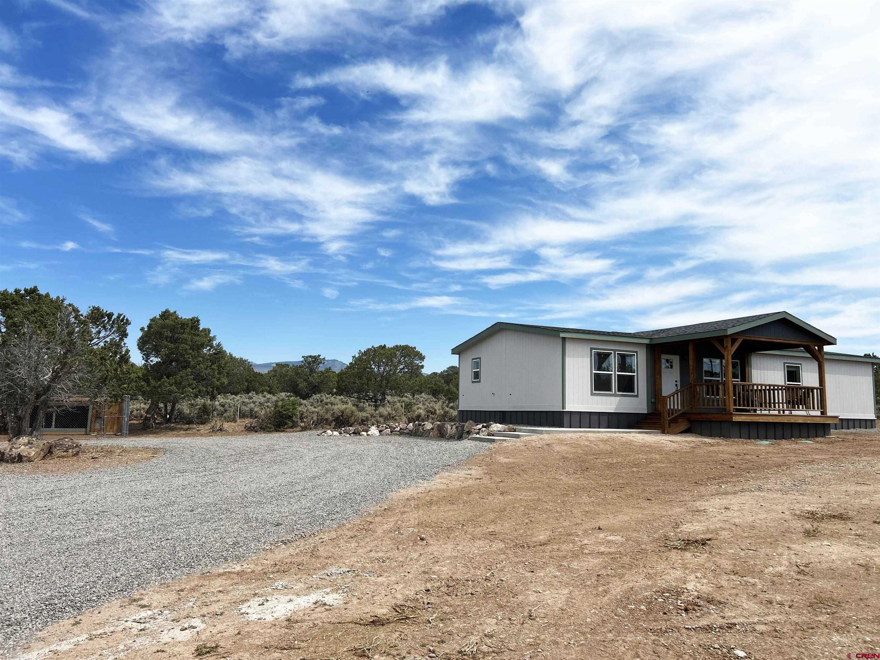 29173 P 50 Road Hotchkiss, CO 81419 - Photo 8 of 38 a view of a house with a yard