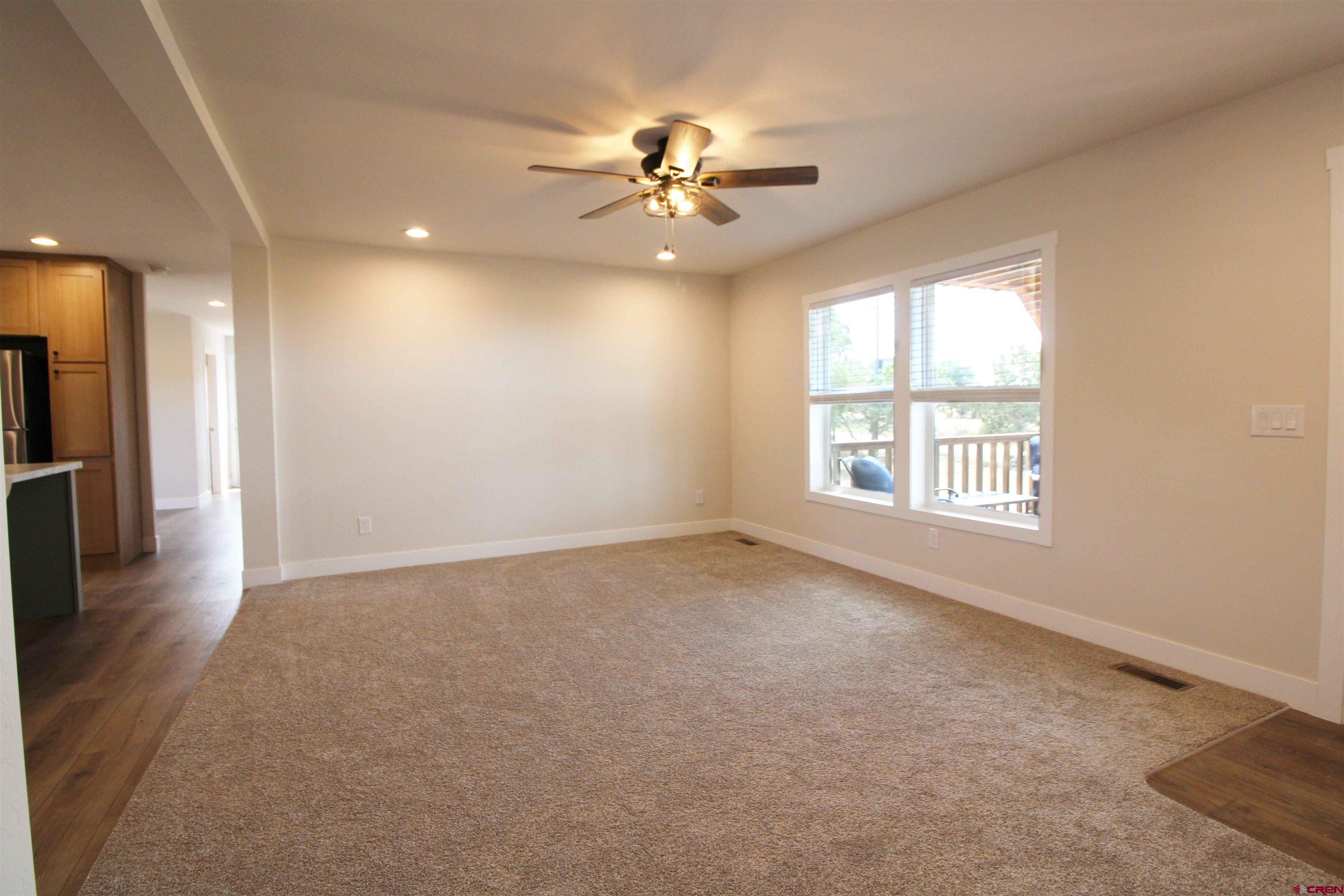 29173 P 50 Road Hotchkiss, CO 81419 - Photo 10 of 38 a view of a livingroom with a ceiling fan and window