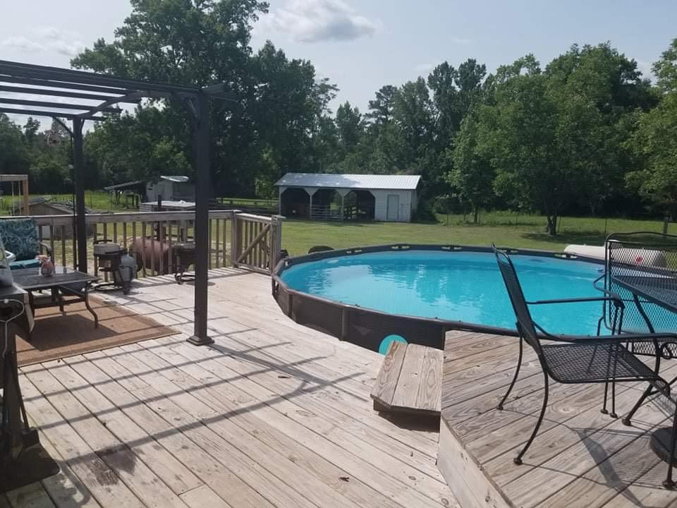 315 Green Lake Road Rockingham, NC 28379 - Photo 8 of 47 Nice pool with wooden deck